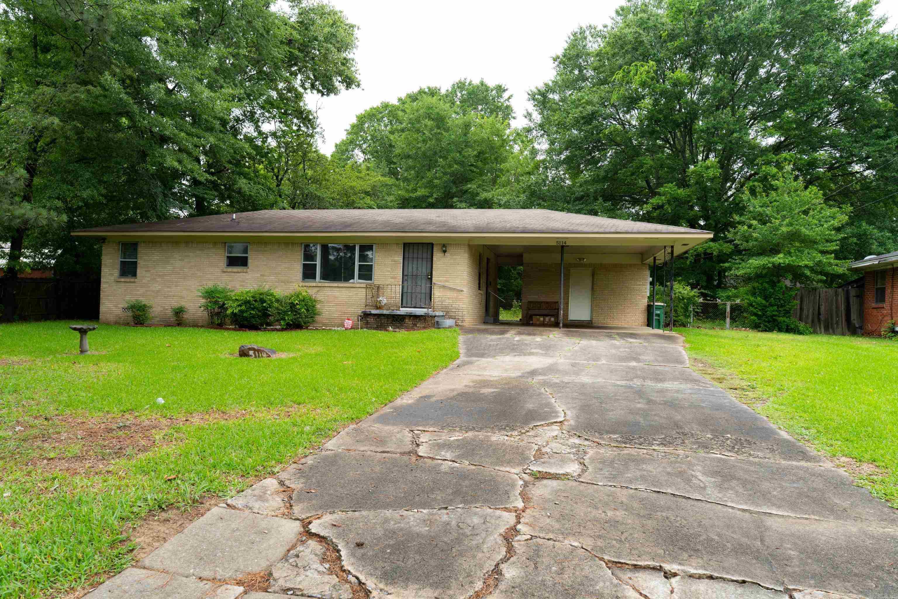 Charming and well-maintained, this 3-bedroom, 1-bath home sits on approximately 0.41 acres and offers ample outdoor space along with practical amenities. Recent updates throughout give the home a fresh, inviting feel while preserving its character and comfort.  Enjoy relaxing or entertaining on the wooden deck overlooking the spacious backyard. The exterior features a concrete carport, a storage shed, and an additional storage building with its own attached carport; perfect for extra parking, workshop space, lawn equipment, hobbies, or additional storage needs.  With a large lot, multiple outdoor storage options, and recent improvements, this property provides both convenience and versatility for homeowners looking for comfort, space, and value. Conveniently located with room to enjoy indoor/outdoor living and close to shopping center and grocery stores.