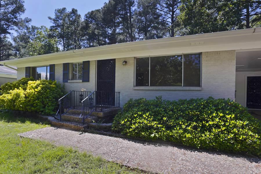 Great for first time home buyers or investors! All brick house with three bedrooms and two baths, two living areas, hardwood floors, covered parking for two cars and fenced yard. Low traffic street in the heart of midtown. Refrigerator conveys!