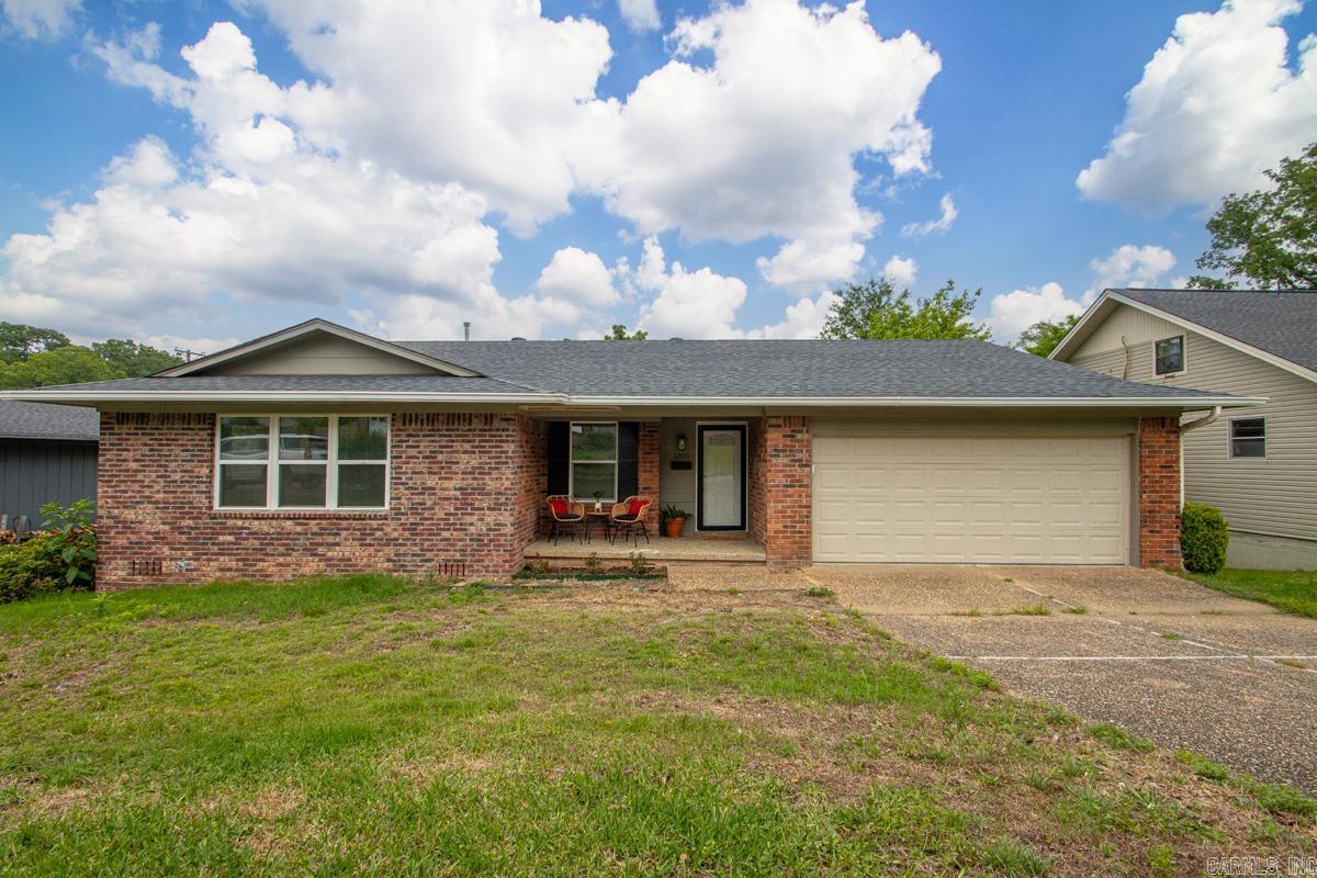 Great home with all the renovations! Pretty brick fireplace and beams in the living room give character, but the renovations make everyday living comfortable.  New open concept living/kitchen spaces. Wonderful neighborhood perfect for family walks and close to grocery, schools, shopping and restaurants. Agents see helpful remarks.
