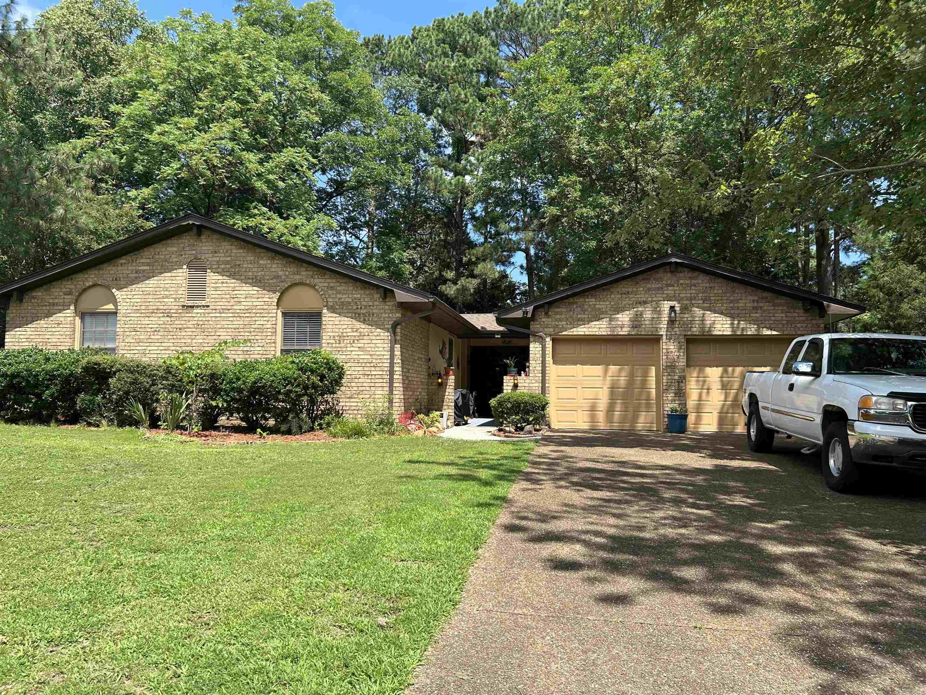 In the heart of Jonesboro, 1775 sq ft 3 bedroom 2 full bath family home. Literally just minutes to schools, restaurants, shopping, grocery stores, multiple medical offices, banks, churches, St Bernard's Hospital and Arkansas State University. The kitchen has granite counter tops, brand new refrigerator and dishwasher and all appliances will convey. Breakfast area , formal dining, open living area with vaulted ceilings, new gas logs in fireplace and hardwood floors. The sunroom is located off of the kitchen and the breezeway has been turned into the screened in porch for outdoor enjoyment. The master suite has its own private bathroom, step in shower and walk in closet. Large fenced in back yard with storage building and play house/storage. Spacious 2 car garage with 2 doors and additional storage. Call for appointment to schedule a private showing.