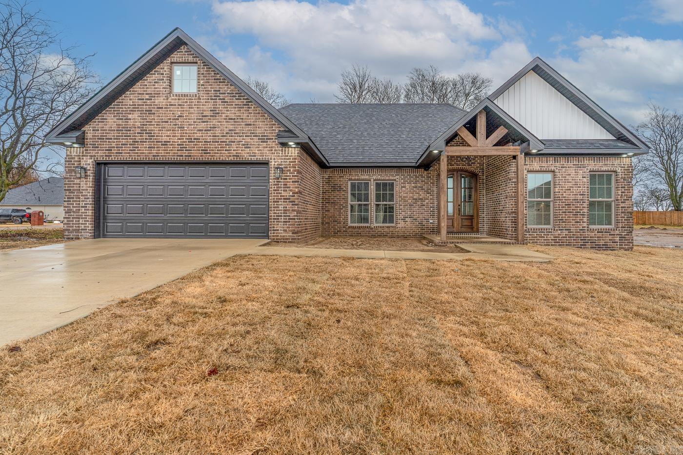 Say Yes to the Address! *1201 Sutton in Manila, AR! New construction, All Brick, 3 bedroom 2 bath, Open concept! Features: Black Granite countertops, Breakfast island, Vaulted ceilings, White cabinets, 1496 sq ft of Beauty! Call or text today for your tour!  **property is in Mississippi County that qualifies for the WORK HERE LIVE HERE PROGRAM - call for details!