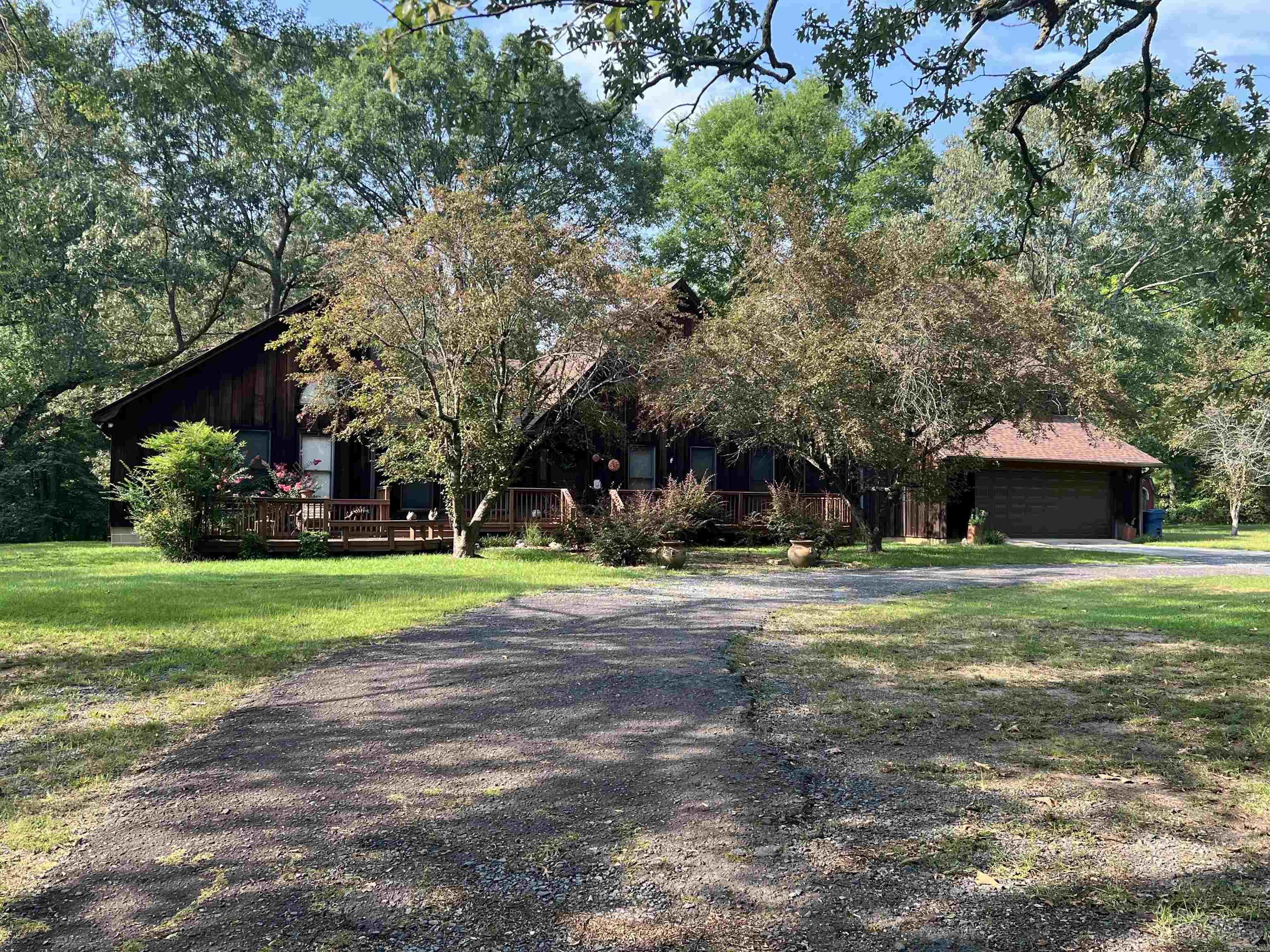 Welcome Home to this lovely Redwood home located on a beautiful 5+ acres, just outside of town. This home is perfect for entertaining with a stunning kitchen that opens up to two living areas. The 3rd bedroom is a loft that is accessed via a spiral staircase, and is equipped with a half bath. Each of the bedrooms that are located on the main level have their own full bath. There is a bonus room located above the garage, that would make a perfect office, craft room, game room, etc. Sit on the back deck and enjoy watching the deer that pass through the property almost daily. There's additional electricity, water, and septic in the back where a mobile home once sat. This would be the perfect spot for that shop that you've always wanted. Call or Text today to schedule your showing. Make your next paradise in this great home and on this wonderful property.