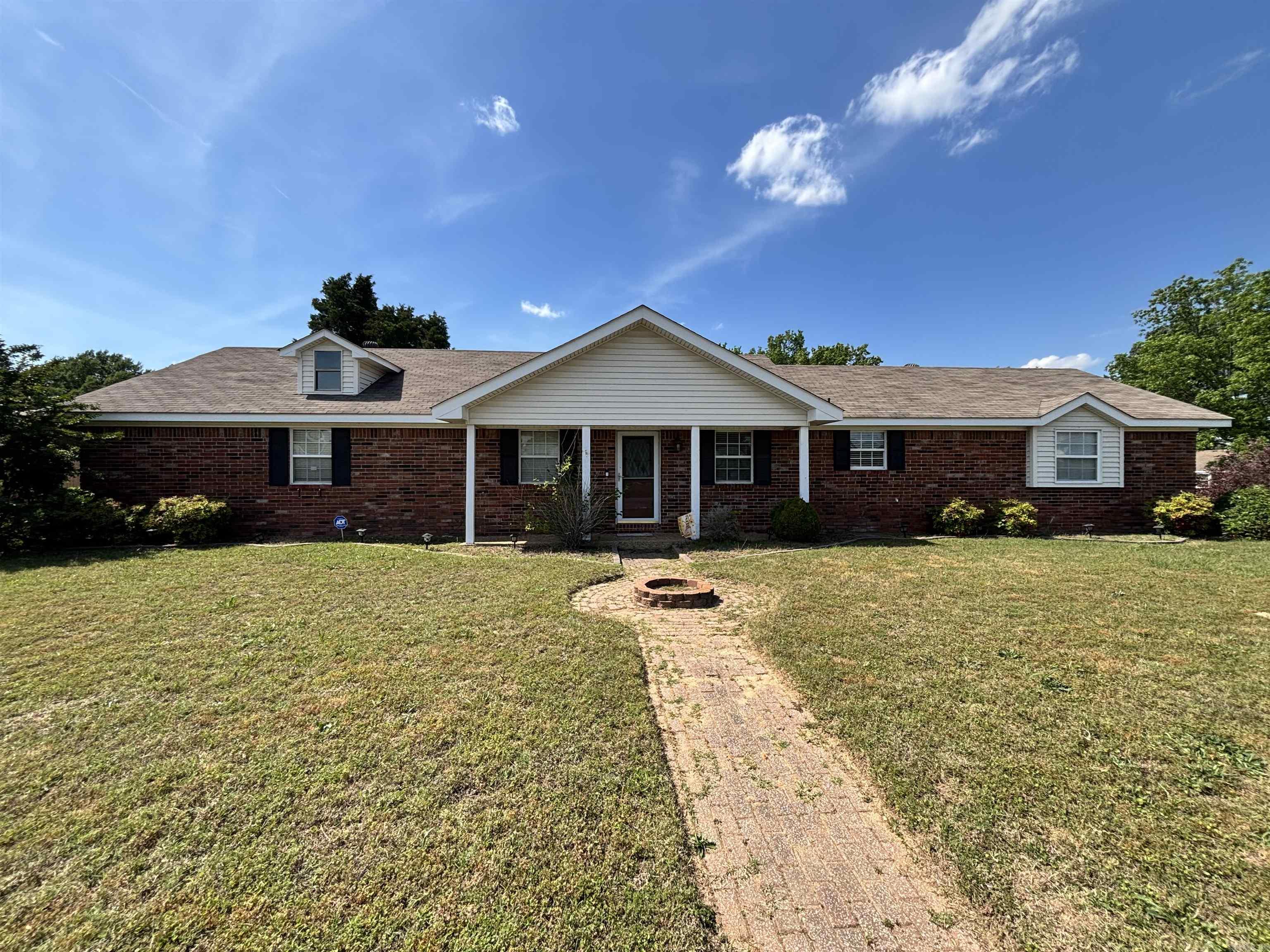 This well-maintained, all-brick home on a prime corner lot is a rare find for patient buyers. Featuring a dramatic step-down living room with vaulted beamed ceilings and a fireplace, the interior shines with hardwood floors and elegant French doors. The primary suite boasts an updated tiled shower and walk-in closets. Outside, enjoy a fenced yard and easy walks to the pool. Roof new 2016  Short Sale Opportunity: This sale requires bank approval and extra processing time. If you have the flexibility to wait, you can secure a high-quality home in a dynamic location at an incredible value.  See Agent Remarks