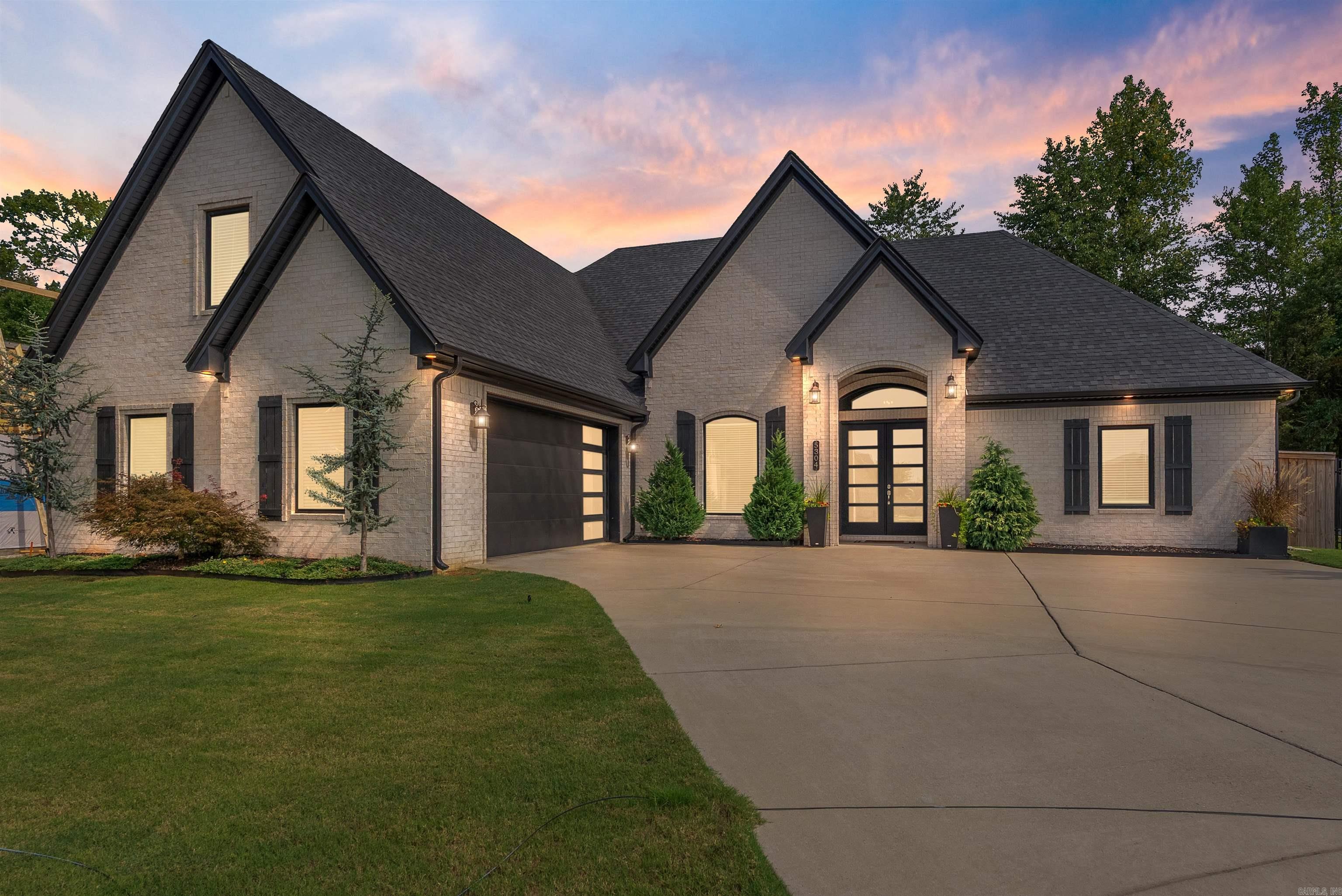 The seller is offering you $5,000 to make this home truly yours- apply it to closing costs, reduce the price! Lower your interest rate, or use it as a credit towards your dream upgrade! An absolutely Stunning 4-bed, 3-bath + office home in Fields of Hurricane Lake Estates! This luxury stunner showcases breathtaking landscaping and curb appeal. New Interior Paint June 2026! The inside features soaring vaulted & coffered ceilings, leathered granite countertops, massive picture-frame windows, and rich wood flooring. Guest bedrooms and the spacious upstairs bonus room (with en-suite bath) are finished with Karastan carpet and ultra-thick memory foam padding for unbeatable comfort.   Now for the showstopper: your dream backyard oasis. Enjoy breathtaking views of lush greenspace filled with deer and birds from one of your two covered patios. Fire up the outdoor kitchen and relax on your expansive one-of-a-kind custom concrete paver patio that spans the entire backyard- designed for peace, privacy, and luxurious outdoor living.   This home has a beautiful status of unmatched curb appeal, refined finishes, and one of the best backyards in the neighborhood- this home is a must-see.