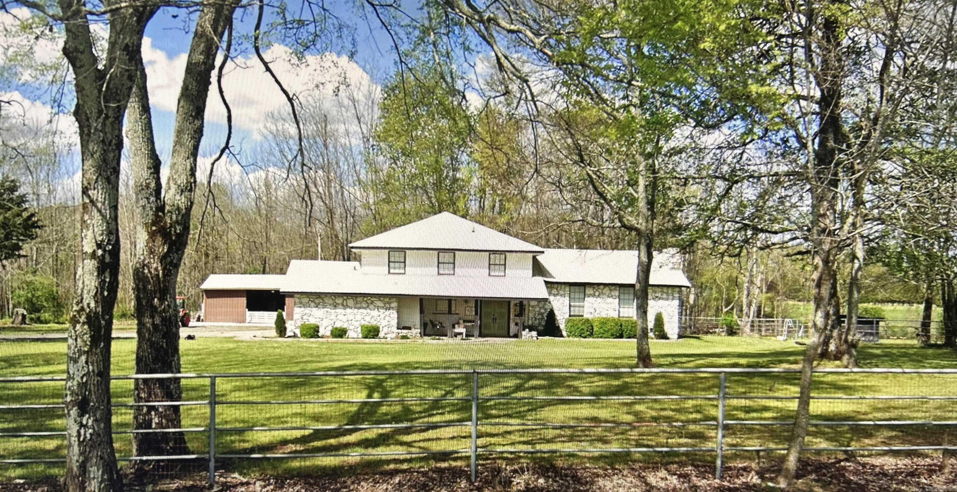 Welcome to this charming country home set on 5 acres of natural beauty, offering privacy, space to roam, and endless possibilities.  Inside you will love the completely remodeled kitchen along with fresh paint and new flooring throughout creating a clean, move-in ready feel. A standout feature is the 475 sq. ft. man cave, created by enclosing the garage and adding a mini-split system for year-round comfort. The property includes a 40x30 barn with durable concrete floors, providing ample space for equipment, storage, or workshop needs. A dedicated corner of the barn houses a chicken coop with its own access door to the yard. It's perfect for those dreaming of fresh eggs and a touch of homestead living.  **Seller incentive!! Receive a $10,000 allowance to use toward closing cost, rate buy-down, or updates to make the home your own!!**