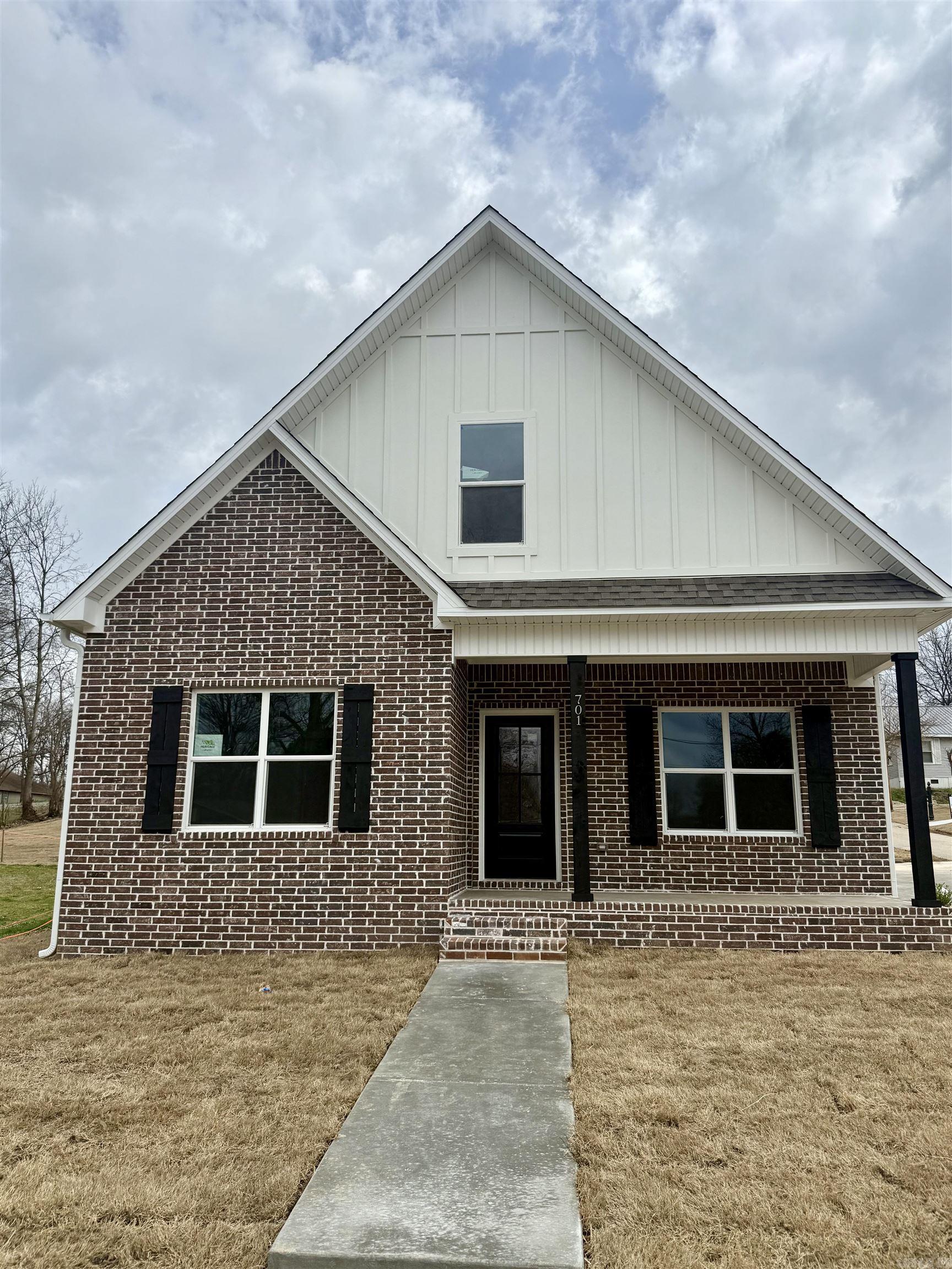 New construction with style and functionality in a prime location! This thoughtfully designed home features a main-level primary suite with dual sinks and a spacious layout. The open living, kitchen, and dining area is perfect for entertaining, highlighted by a large island with breakfast bar seating. You’ll also love the oversized laundry room and convenient mudroom area. Upstairs offers two additional bedrooms and a full bath. Granite countertops and durable LVP flooring run throughout the home for a cohesive, low-maintenance finish. Step outside and enjoy direct access to the 8-mile walking trail right in front of the home! (Tax amount reflects land only.)