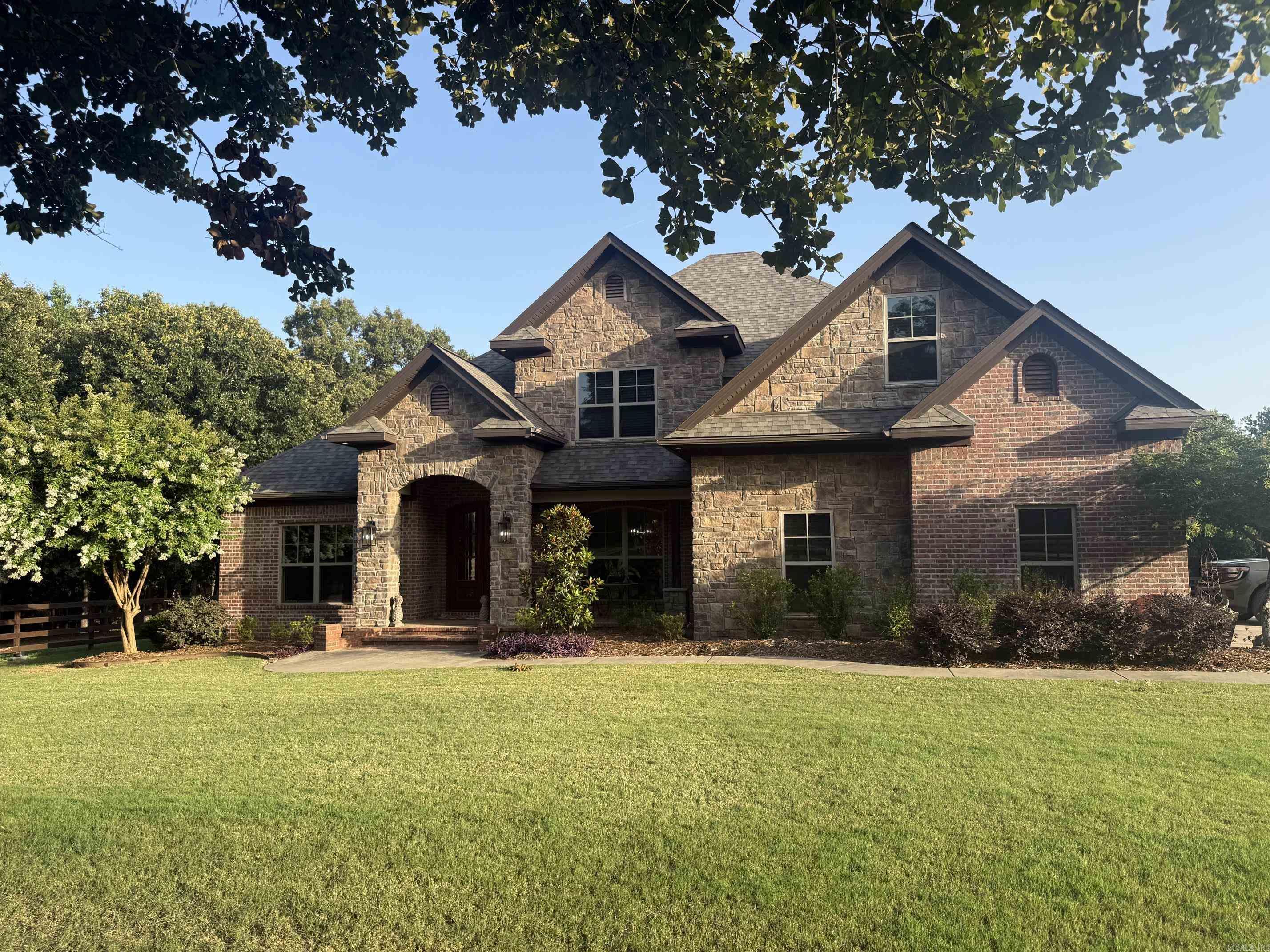 Beautiful well maintained home on 10 manicured acres with a shop.