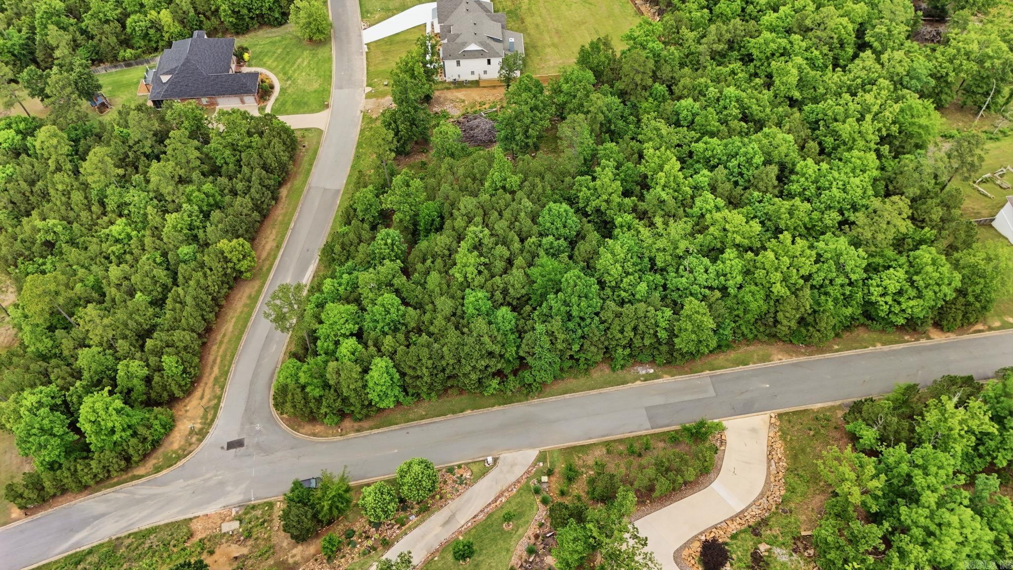Prime lot located at 1800 Waterview Meadows Court in the desirable Waterview Meadows Estates community in Roland. This property offers the perfect opportunity to build your custom home while enjoying an unmatched neighborhood lifestyle. Community amenities include a basketball court, football and soccer fields, pickleball and tennis courts, a bonfire area, and miles of scenic nature walking trails. Ideal for those seeking space, recreation, and a peaceful setting just minutes from city conveniences.