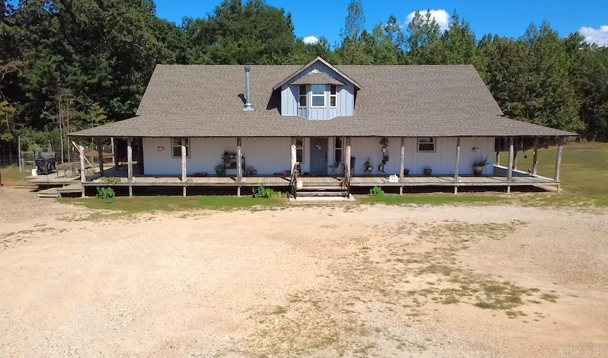 New Survey on file! LISTED BELOW APPRAISAL! MOTIVATED SELLER! 3 acres located outside the town of Cove. Featuring this 3200 sq ft 4-bedroom, 3 bath home built in 2022. Granite countertops, beautiful wood floors & ceramic tile throughout. White Oak staircase to second floor. Wood burning stove for backup heat. Amazing wrap around porch with decks, could be great for Saturday morning coffee sipping or enjoying your evening cooking out with family & friends. Vapor barrier & lights installed in crawlspace under home. New 26x24 chicken coop. 12x20 storage building. Two RV hookup combination boxes containing 110, 30 & 50 amps, each having own Water & Sewer. 32'x110' Metal Shop with 16 ft sidewalls, concrete floor & foam insulation from ground to peak. Septic is available to shop. Over 1000' Highway 71 frontage. Great business opportunity!