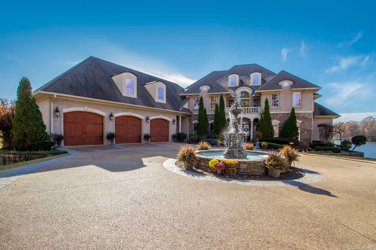 This gorgeous lake home was custom built with top of the line design in architecture, engineering & energy efficiency. No detail was overlooked! Views of the lake from EVERY room! Tuscany & french country flair with tobacco stucco finishes, high ceilings, large windows, archways & elegant trim work. This versatile home was designed for both relaxing & comfortable living but also perfect for entertaining large groups. Veranda is situated perfect for watching sunsets over the pool! See Agent Remarks.