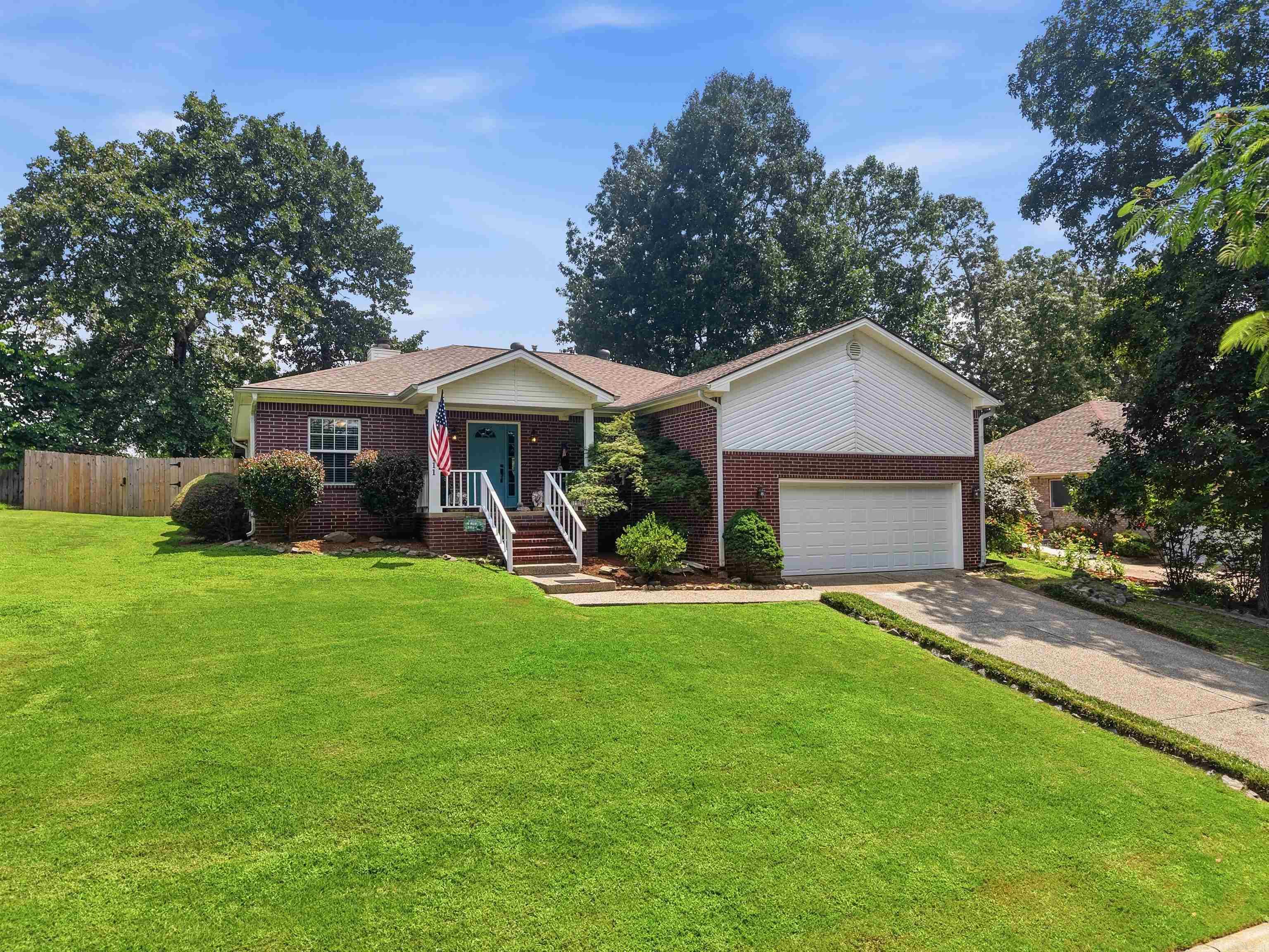 Lake Hamilton living without the waterfront price tag! Located just minutes from public Lake Hamilton access for boating, fishing and swimming. This beautifully updated 3-bedroom, 2-bath home in the Lake Hamilton school district offers 1,668 square feet of comfortable living in the highly sought-after Lake Hamilton School District. Built in 2000 and thoughtfully updated throughout, this move-in-ready home features vinyl plank flooring, a spacious living area with a natural gas fireplace, and updated bathrooms, including a beautifully remodeled guest shower. Major improvements include a new roof (2022), new privacy fence (2022), new water heater, newer garage door, and an HVAC system that has been regularly serviced and maintained. Step outside to enjoy a covered back porch with a metal roof and an open patio surrounded by lush landscaping, mature plants, and colorful flowers that create a peaceful backyard retreat. Situated in a beautiful established neighborhood, this home offers the perfect combination of modern updates, convenience, and outdoor enjoyment, with boating, fishing, and recreation just 7 minutes away.