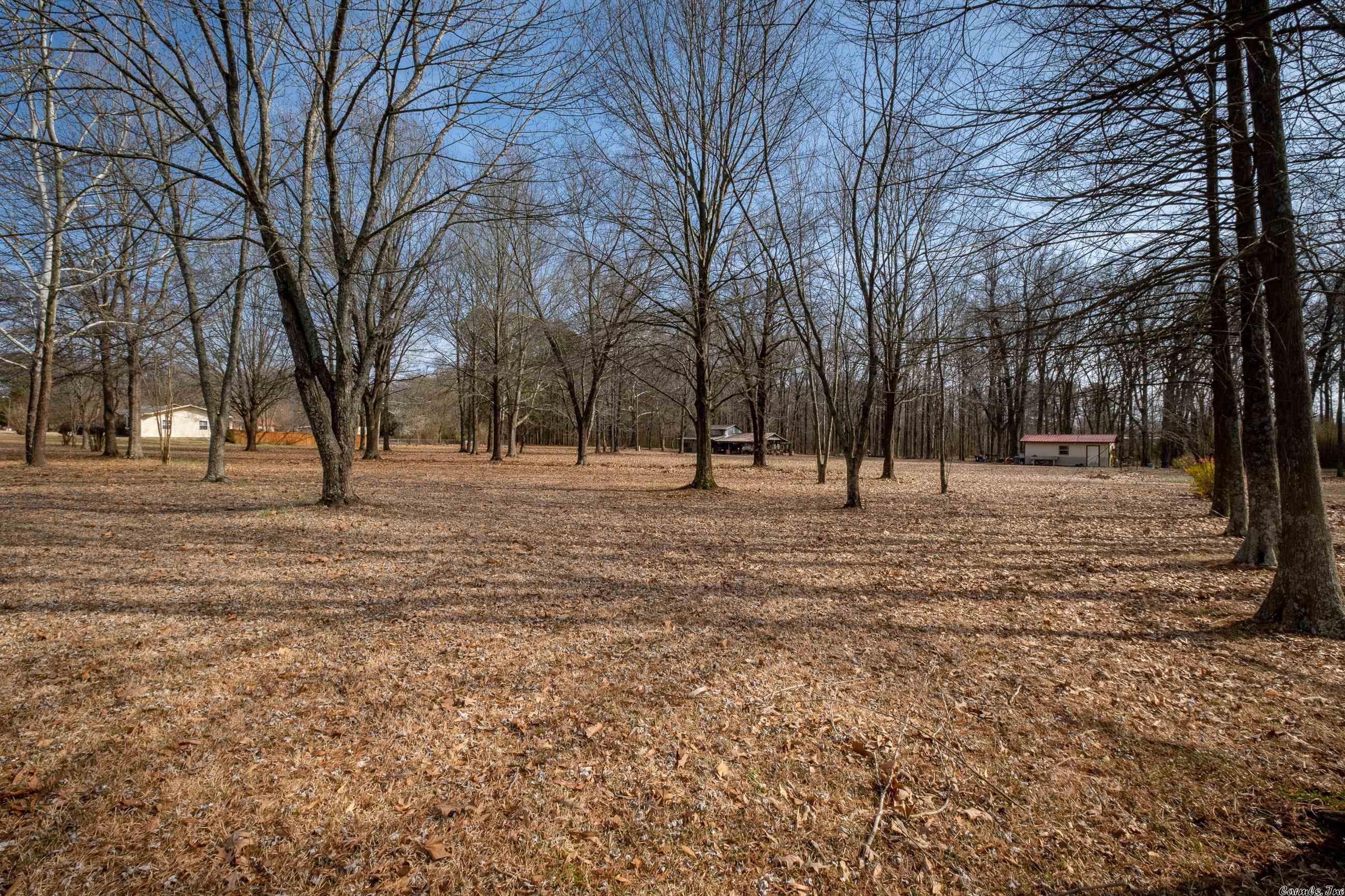 This residential, vacant lot is approximately 0.45 acres in size, providing ample space for a future home to be built upon it. The surrounding area is quiet and peaceful, with a mix of residential properties nearby. One of the standout features of the lot is the presence of a few mature trees, which provide natural shade and privacy, and add to the overall aesthetic appeal of the property, creating a serene atmosphere that is perfect for a home with easy access to nearby amenities and attractions.