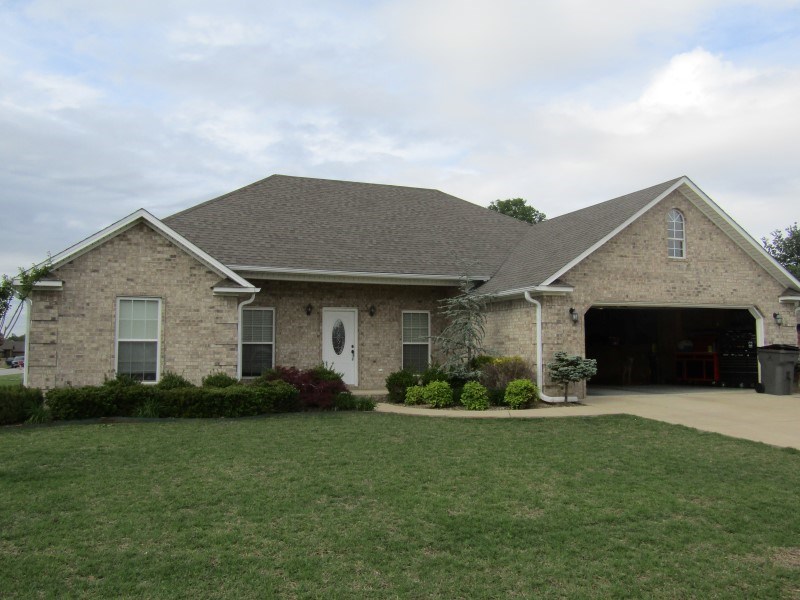 This beautiful, all brick, three bedroom and two bath home features an open/split floor plan. The master bedroom is oversized and contains a large master bath with shower and separate soaker jet tub along with a very large master closet.  Walking into the living area, you will find beautiful hand scraped acacia hardwood flooring and vaulted ceiling flowing into the beautiful open kitchen.