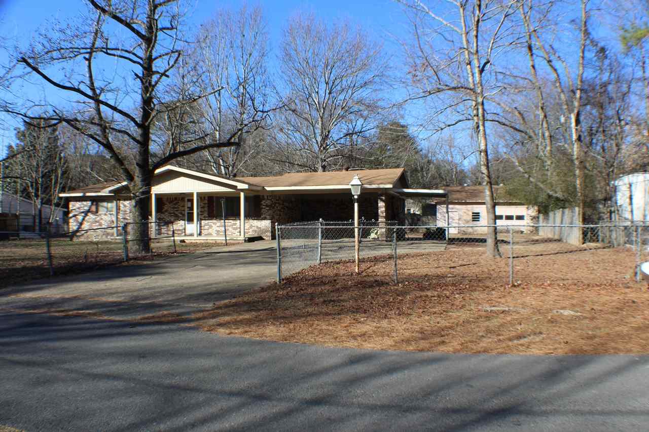 Brick, Lake Hamilton School District, 3 bedrooms and 2 baths with a Jack & Jill bath, open kitchen, living and dining, bonus room could be 4th bedroom, fully fenced level lot with shade trees, 1540sf, 3 car carports, 30 x 30 shop. Needs some fixin' up.