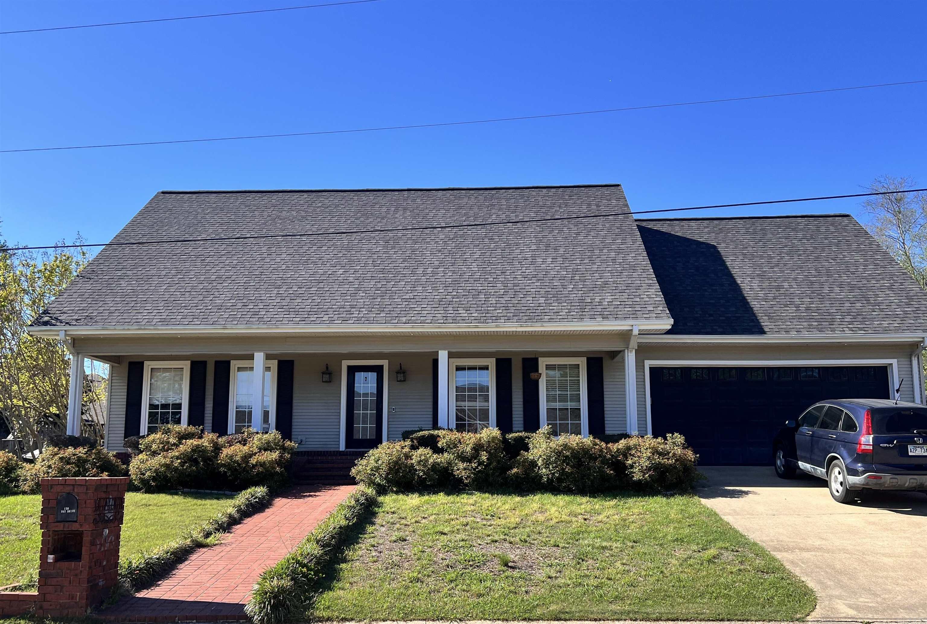 Welcome to this beautiful 2-story home located in a highly established neighborhood. Located adjacent to the Monticello Country Club with less than 0.2 miles to walk or access via golf cart!    This property offers 4 spacious bedrooms, all with walk-in closets and 2.5 baths. The primary suite is conveniently located on the first floor and includes his and her walk-in closets. Also has a large en-suite bath with dual vanities, including a dedicated space perfect for getting ready!  The home boasts a large kitchen with an open concept layout, ideal for hosting and gathering.  Upstairs, you'll find beautiful skylights and oversized arched windows that fill the home with natural light.  Additional features include built-in desks with lighting in select bedrooms - perfect for studying, hobbies, or working from home. Step outside to enjoy the oversized, fully fenced backyard complete with a covered back porch, ideal for relaxing or entertaining.  A separate garage with a roll-up door provides excellent storage for lawn equipment, ATVs and more. With beautiful landscaping, generous living space, and a prime location, this home truly has it all. Don't miss this excellent opportunity!