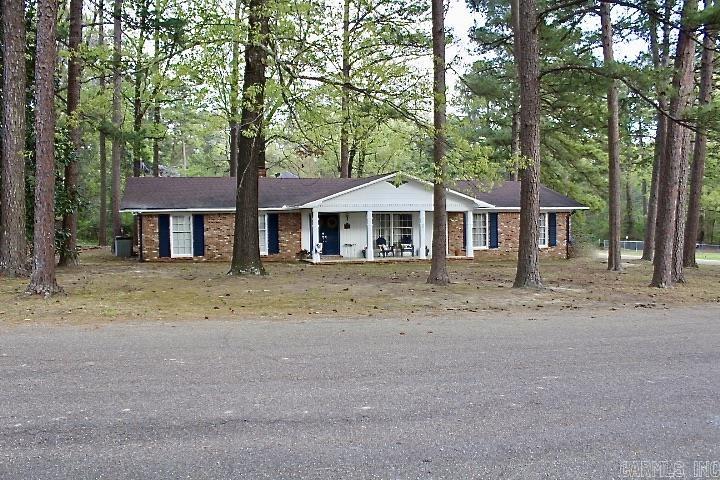 Come see this charming  home situated on a corner lot in one of Fordyce's most desired neighborhoods. This 3 bedroom, 2 bath home features an open kitchen equipped with granite countertops, stainless steel appliances and a spacious island that's perfect for dining, meal prep or simply hanging out. This open-concept kitchen allows you to choose whether the adjoining space with a fireplace serves as a dining area or cozy family room. French doors open into an additional flexible living space suitable for dining/family room, game room, music room or anything else you envision. This stunning home is nestled among tall pine trees and features a screened-in-porch where you can relax and savor the tranquility of the outdoors. These versatile spaces give you the freedom to create your own personal oasis and make it your own. Let me show you how easy it is to make this YOUR new place to call HOME!