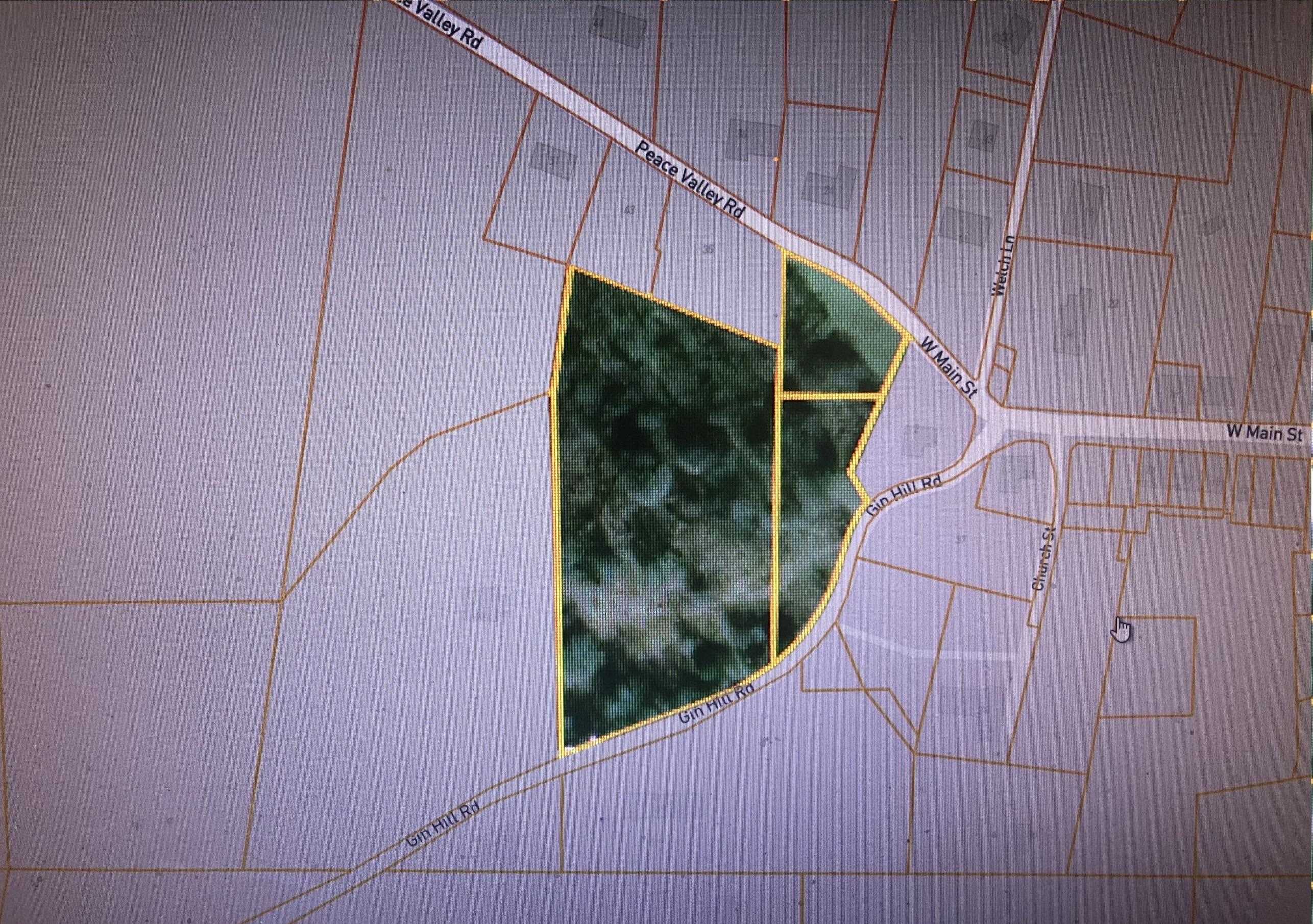 5.38 WOODED ACRES COMMERCIAL PROPERTY IN CITY OF ASH FLAT.  Bordered on two side by paved city roads... Peace Valley on one side, Gin Mill on the other.  City sewer and water available, NEXT high speed internet service available.  City may be petitioned to rezone to residential to allow a home with chickens and a couple of horses or cows.  This property has rolling terrain with a small pond and is located just off Main Street, close drive to Highland schools, churches and Walmart shopping.  Great potential!