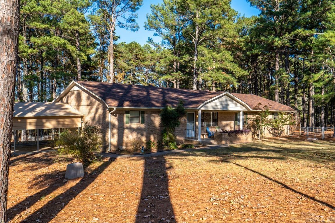 All brick home built in 1978 has 1952 sq. ft. on 4.1 acres with wonderful possibilities for this amazing property.  It is a one-level with nice family/living and separate dining area, 4 bedrooms, 3 baths and a new roof in September 2023. The kitchen features nice cabinets, an electric range, dishwasher and oven.  The over-sized laundry room also has a sink.  Two-car garage with a large shop and an additional 2 car carport. Private, quiet area with a brand new 10x16 storage building on 4.1 beautiful acres...you'll feel like you are either at your own park or miles from the city but really only minutes from the school and close to shopping and medical facilities.  Plenty of room for kids, grandkids or furry friends to play in the front yard or back patio.  Perfect for a young family or a great retirement property.