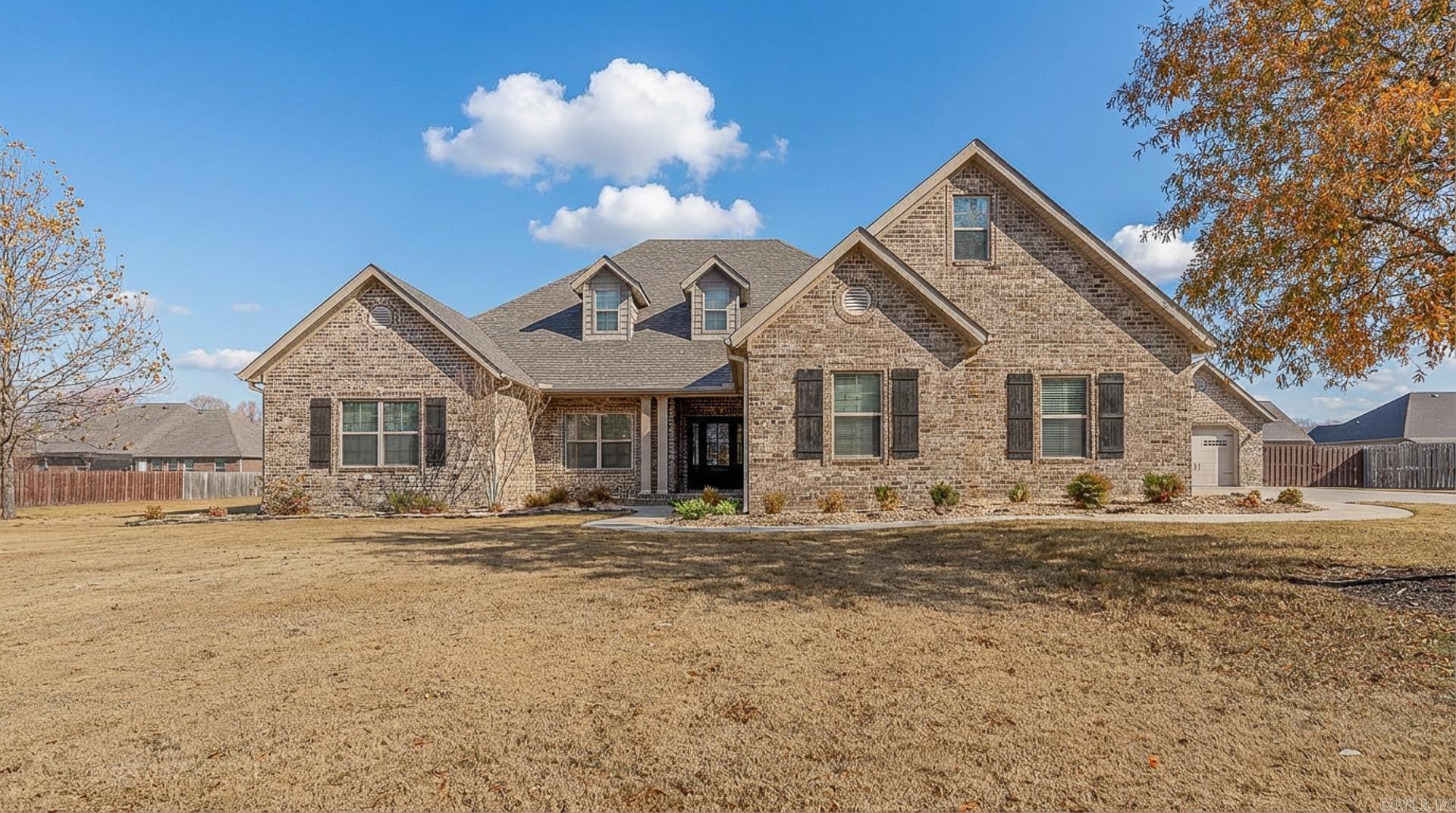 Beautifully maintained 5-bedroom, 3-bath home on a double lot with all the extras. The spacious great room features a fireplace with built-ins and flows into an island kitchen with double ovens, a double-glass-door pantry, and a built-in buffet off the dining area. The floorplan includes an office/den, a huge centrally located laundry room with cabinets and hanging space, and heated/cooled storage off the garage plus a storm room. Enjoy outdoor living on the screened porch overlooking the wood-fenced backyard. Property also includes a double garage, a detached shop, and a whole-home Generac generator. This one has the space, the storage, and the amenities that make everyday living easy.