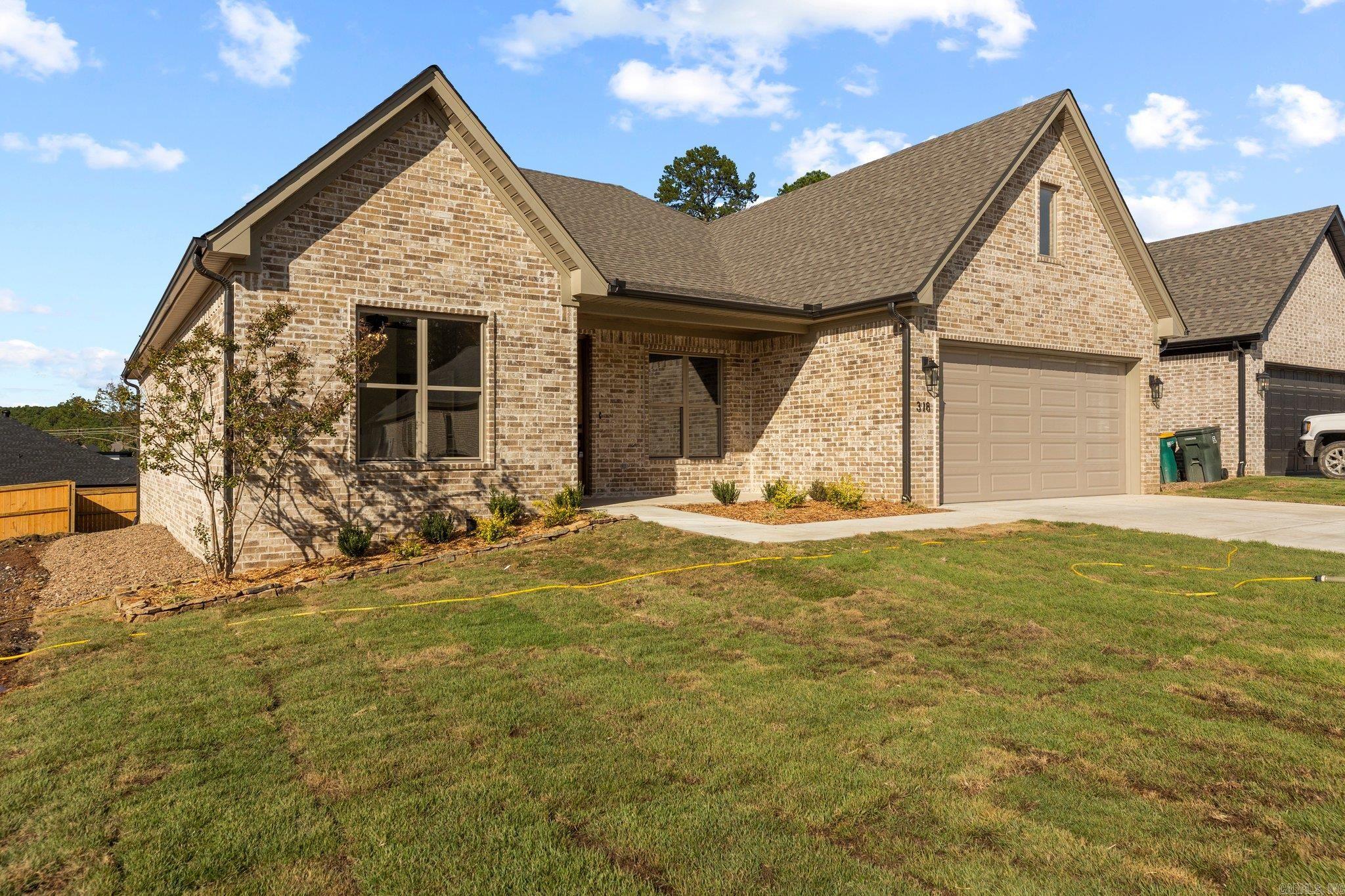 $10K Builder credit towards rate buy down and/or closing costs with approved offer!  Meticulously designed by Graham Smith Construction, this masterpiece is one of your last chances to snag a new construction home in the highly sought-after Parkside at Wildwood community. Never mow again with lawncare included in your yearly POA - that's right, your front and back lawn care will be taken care of! 318 Rosemary offers a thoughtful layout that is perfect for function and style; the chef's kitchen with custom cabinetry that overlooks the spacious dining and living area are truly stunning. The covered back porch area with an outdoor fireplace will be the perfect place to relax this Fall as you overlook your lawn. Make sure you check out the luxurious owner's suite on the back of the home that features a spa-like oasis and a custom closet that dreams are made of! Every detail has been thought of with your every need kept in mind.