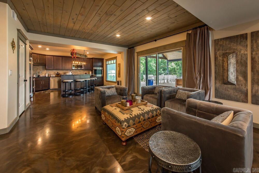 Suite 303 - Top-floor penthouse in the Narrows Inn, one of nine totally renovated lakefront condos offered at auction. This 3 bed / 2 bath condominium (~2,155 SF) features the largest interior in the property plus a massive covered patio overlooking Narrows Marina and Greers Ferry Lake - vaulted ceiling, recessed lighting, multiple ceiling fans, and multiple seating areas ideal for entertaining. Open living with surround sound and bar-height gathering table; kitchen with large island, Electrolux and Samsung appliance packages, and a secondary drink refrigerator. Primary suite with electric fireplace, sitting area, expansive walk-in closet, and oversized double-vanity bath with large walk-in shower; two additional bedrooms, hall bath, Electrolux washer/dryer, and a 100-gallon Rheem Marathon hot water heater. Offered through the Buyer’s Ultimate Choice auction with SOLDasap - bid on a single unit, any combination, or purchase all nine condos as a portfolio. Visit soldasap.com or call 870-236-6117 for full terms and conditions.