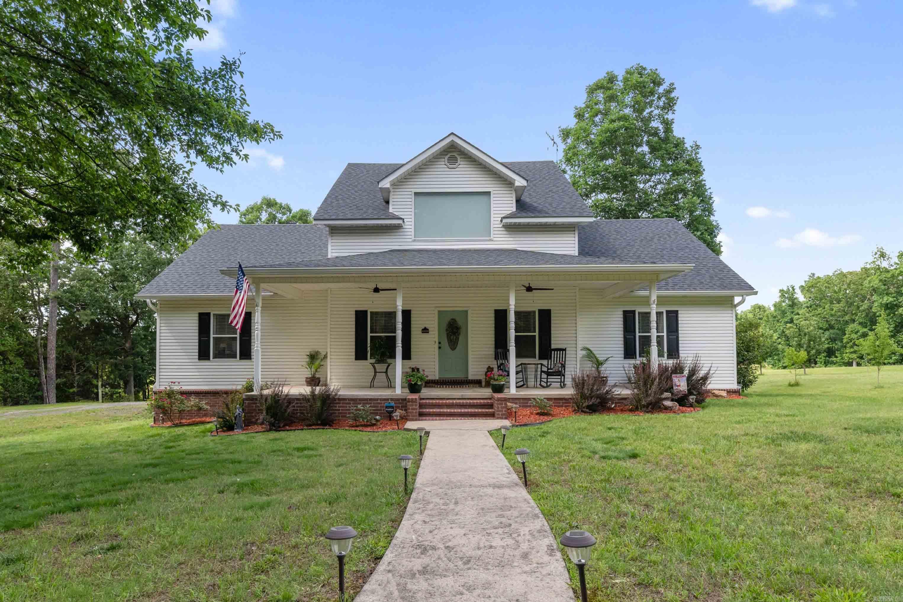 Welcome to your own private paradise! This immaculate newly updated 2,460 SF farmhouse is the perfect blend of peaceful country living and modern comfort. Situated on 8 secluded acres just minutes from town, this stunning property offers the best of both worlds — privacy, convenience, and breathtaking surroundings. Inside, you’ll find 3 spacious bedrooms and 2 updated baths, along with a gorgeous open kitchen and living area designed for gathering with family and friends. The upstairs bonus loft is the perfect place to enjoy a game of pool, create a second living space, or simply relax & unwind. Step outside and experience true country charm with a fenced backyard, chicken coop, fruit orchard, circular driveway, and abundant wildlife you can enjoy from the back deck. The oversized 2-car garage provides plenty of room for vehicles, storage, & hobbies. New roof, new HVAC, new hot water heater, new kitchen granite countertops, new kitchen appliances, totally new primary bath, new flooring  & new garage door are just a few of the many updates you will find. Every detail was carefully throughout in this lovely farmhouse and is truly move-in ready & feels like home the moment you arrive.