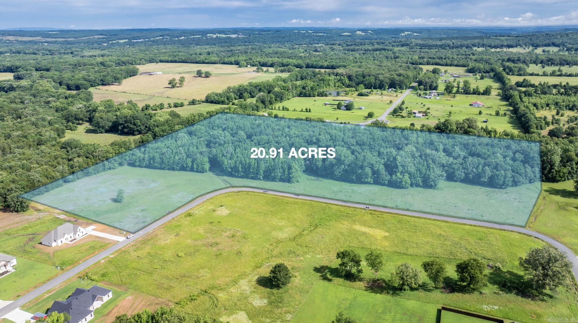 Nice Subdivision in Greenbrier in the Wooster Elementary school zone. 2000 Sq. ft. minimum. Underground utilities. This land would be perfect for someone that needs pasture and woods for hunting. Jack Fork Creek runs through the property and there is plenty of deer sign at the creek. This is the perfect location with a pretty spot for home in a restricted neighborhood but you can still have a large parcel of land for outdoor activities. Would be a great area to build trails for riding in the woods.