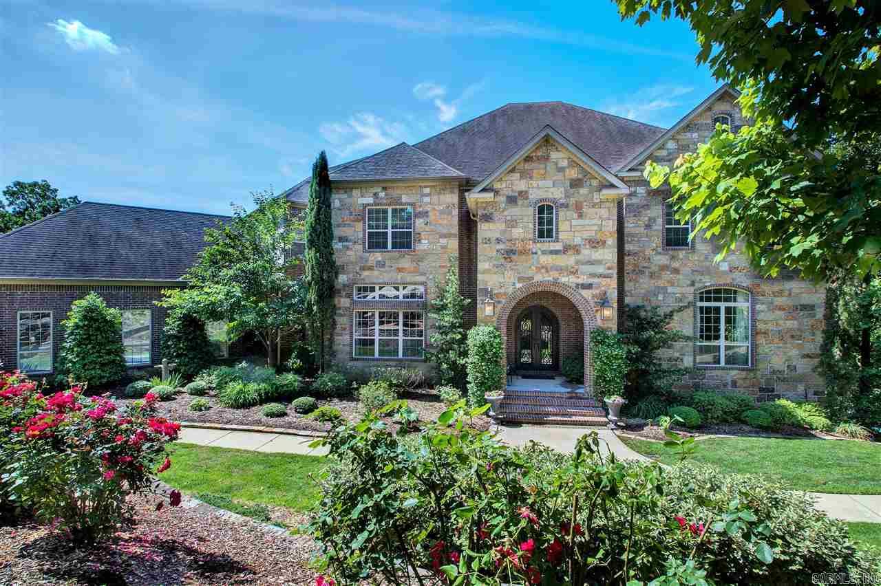 TRULY ELEGANT home situated on Lake 1 in Lakewood. Step into the 2 story foyer with gorgeous curved staircase. Fabulous barrel ceiling through main hall which opens to spacious Great Room & Kitchen, ALL overlook the lake. Spacious master, Kitchen w/granite, center island, pantry & butler pantry. 2 story library/office,  Downstairs has huge separate living, game room area, bath, sauna, changing & workout rooms (could be BR), sound proof music room & media room.  In Ground Pool, storage galore. STUNNING!