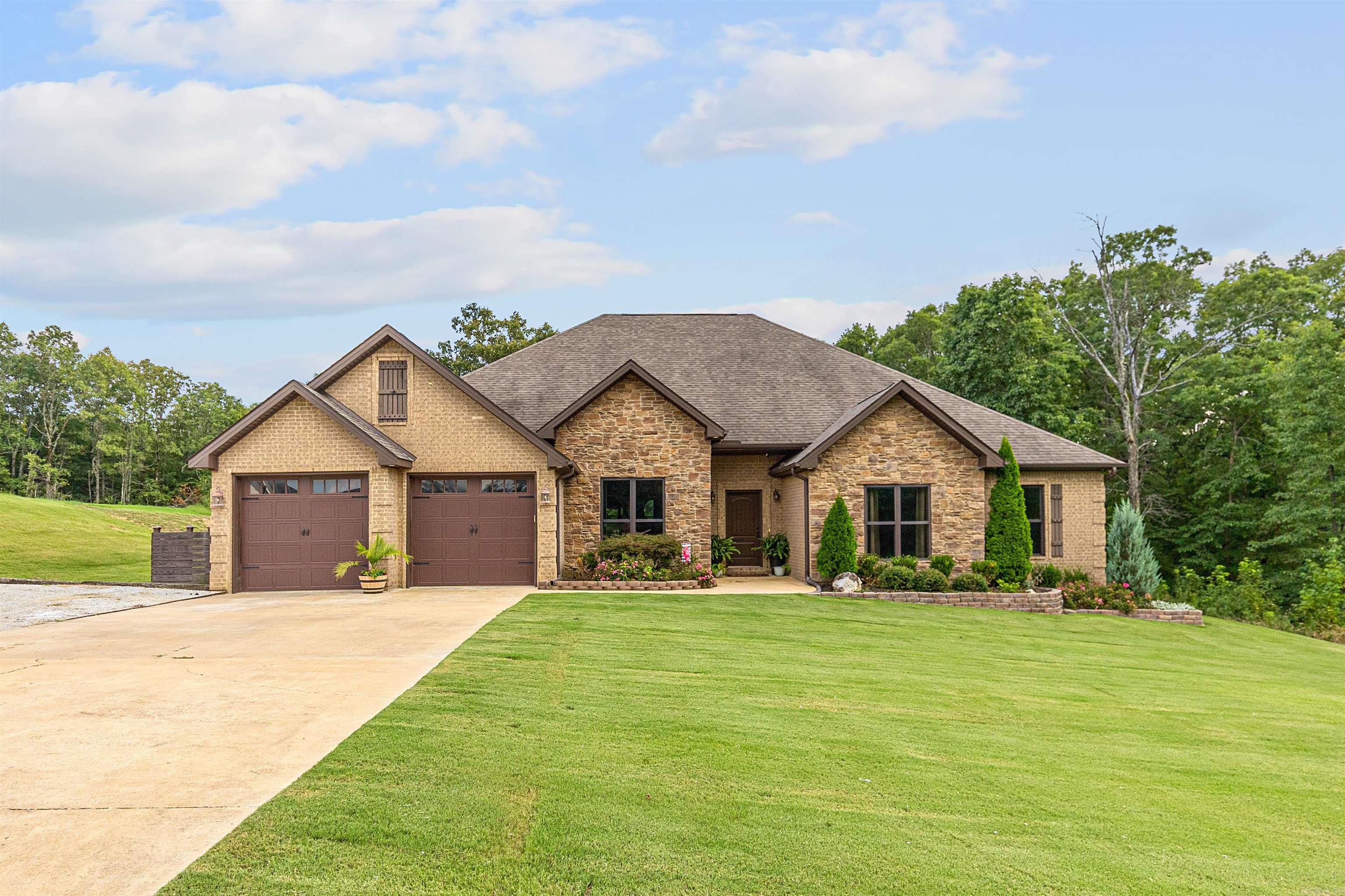 Don't miss this amazing 4 bedroom 3 bath home on Crowley's Ridge. This beautiful open floor plan home with built with a attention to detail. From the crown molding throughout, to the amazing feature wall in the dining area.  The spacious open living area that opens up to the enclosed porch and covered patio. Nestled on  1.25 acres this is great for outdoor entertaining as well.