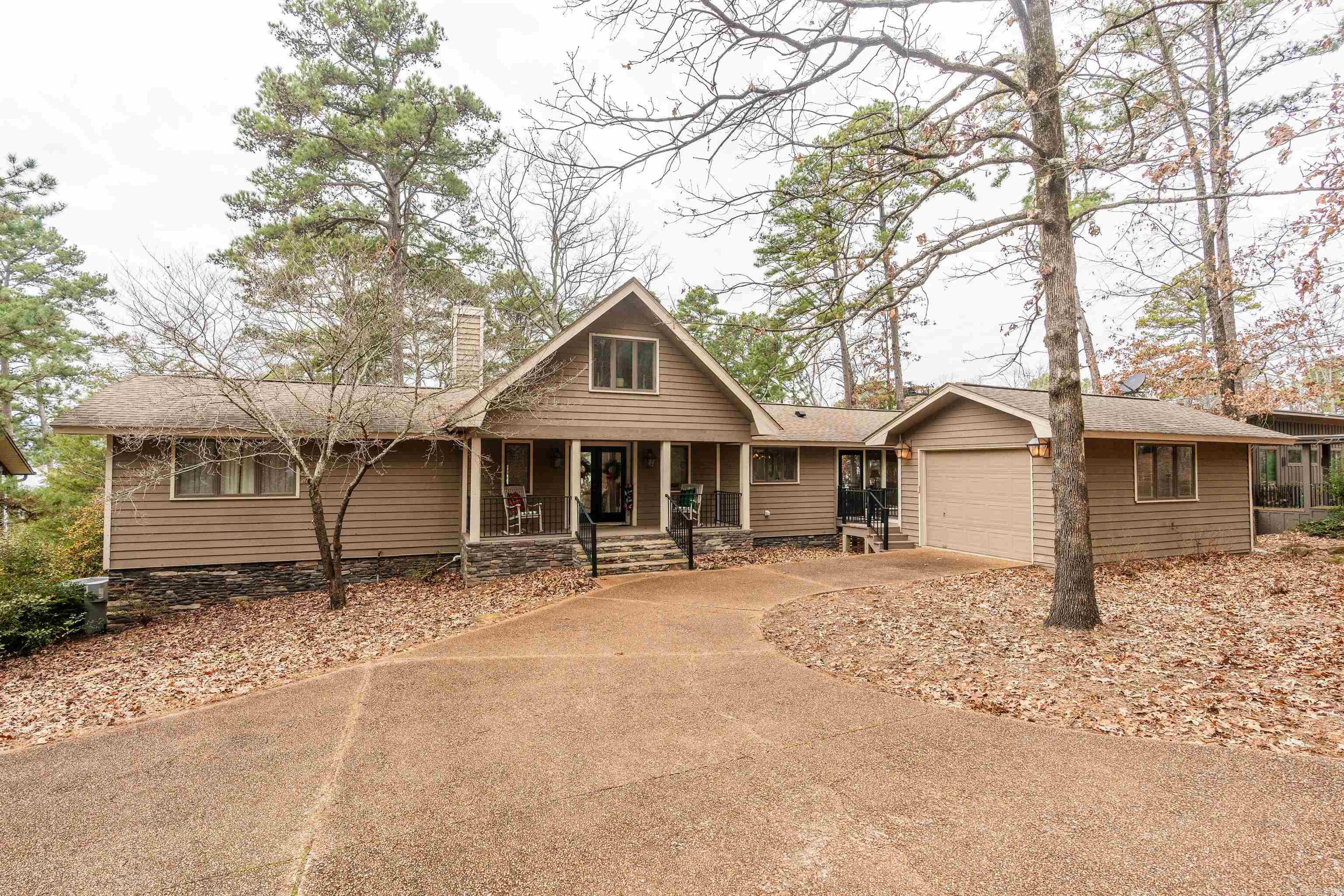 EDEN ISLE - FURNISHED LAKEFRONT HOME!!! -- This lovely Frank McGary-designed home on the west side of Eden Isle has a great lake views and an easy walk to the water! 3-bedrooms plus a 4th loft bedroom, 2 living areas, HUGE screened porch, new roof (in approximately 2017), tons of interior updates in last few years (including brand new kitchen and brand new master bath!) and a foundation that's piered to bedrock! The sunsets will be spectacular! Hurry to see this one!