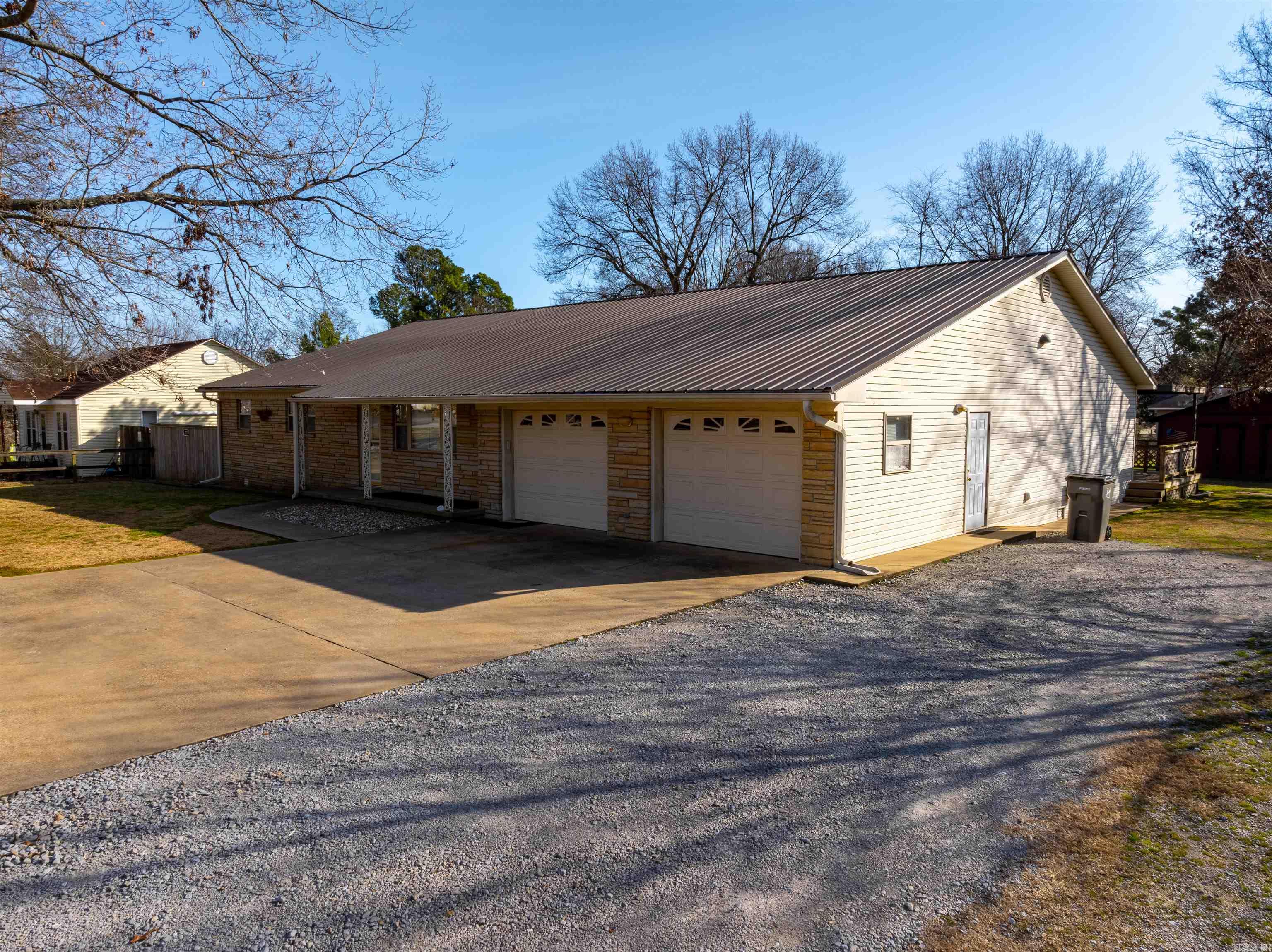 Stunning Ranch-Style Brick Home in Newark, Arkansas – Move-In Ready!  Welcome to this beautifully maintained 4-bedroom, 3.5-bathroom ranch-style home with approximately 2,720 sq. ft. of heated/cooled space in the heart of Newark, Arkansas. Situated on a level half-acre lot, this home is packed with features designed for comfort and versatility.  Features You’ll Love: Dream Kitchen: Oak cabinets, ample counter space, cooktop electric range, wall oven, matching appliances, and a walk-in laundry room with shelving, pantry space, cabinets, and countertops. Multi-Purpose Space: A large game room with a kitchenette, primary bedroom with en-suite, full bath, and access to a screened-in porch—perfect for a mother-in-law suite or entertaining. Additional Bedrooms: Three generously sized bedrooms, including one with a half bath, plus a full hallway bathroom. Low Maintenance: Brick siding, a metal roof, and updated interiors make this home move-in ready. Extras Included: Kitchen appliances, washer/dryer, pool table, and accessories.