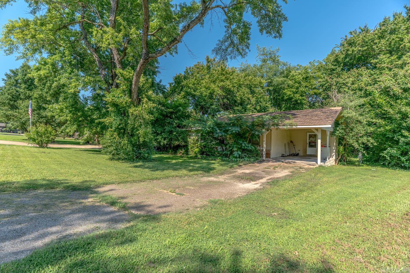 Fixer-upper potential shines at 1135 Meadowcrest Dr in Mountain Home, AR. Offering an incredible equity-building opportunity for savvy investors, flippers, or handy homeowners. This 1,056-square-foot, 2 bedroom, 1.5 bathroom home has a fantastic foundational footprint and cozy layout, including a fireplace and a covered back deck. This property can easily be transformed into a beautiful starter home, a high-yield rental property, or a peaceful place to downsize.  Investment Highlights  Equity Builder: Priced to reflect needed updates, allowing room to build immediate equity.  Outdoor Space: Features a functional carport, large shade trees, and a covered back deck ready for outdoor living.  Prime Location: Tucked away in a quiet Mountain Home neighborhood close to essential local shopping and dining.