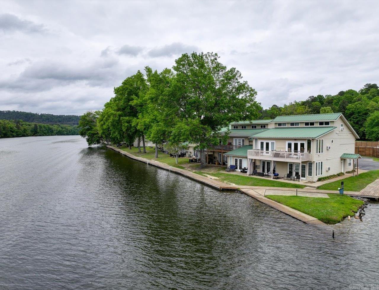 Turnkey Lakefront Condo on Lake Hamilton – Fully Furnished & Short-Term Rental Ready  Welcome to 179 River Mill Court, Unit D1—an exceptional opportunity to own a fully furnished, turnkey condo on the shores of Lake Hamilton. Whether you’re searching for a personal getaway, investment property, or income-producing short-term rental, this property is ready to go from day one.  This well-maintained unit offers direct access to one of Hot Springs’ most desirable lake destinations, making it ideal for vacationers year-round. Inside, you’ll find a comfortable, thoughtfully arranged space designed for both relaxation and functionality, with furnishings and essentials already in place for immediate use or rental.  Enjoy the convenience of low-maintenance condo living paired with the lifestyle benefits of lakefront ownership. Spend your days boating, fishing, or enjoying the scenic water views, all just minutes from dining, shopping, and entertainment in Hot Springs.