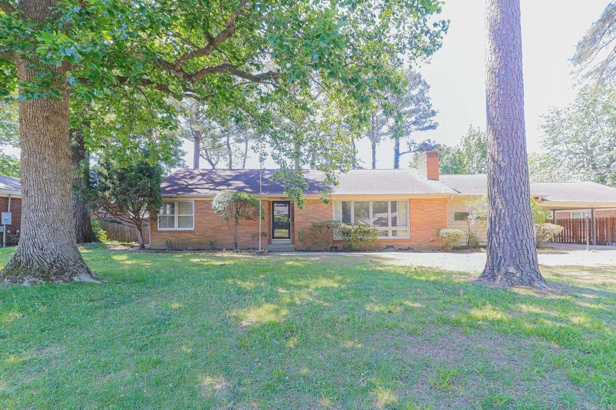 Welcome home to this charming single-level family residence nestled in a highly desirable location with beautiful landscaping and mature shade trees that create a warm and inviting setting. Thoughtfully maintained and updated, this home features a new water heater along with updated plumbing and bathroom fixtures, offering both comfort and peace of mind.  Inside, you'll find a spacious and functional layout designed for everyday living and entertaining. A standout feature of the home is the large family room addition complete with a cozy wood-burning fireplace - the perfect gathering space for holidays, relaxing evenings, or entertaining friends and family.  With its combination of charm, updates, and comfortable living spaces, this home offers the ideal blend of convenience and character for families of all sizes.