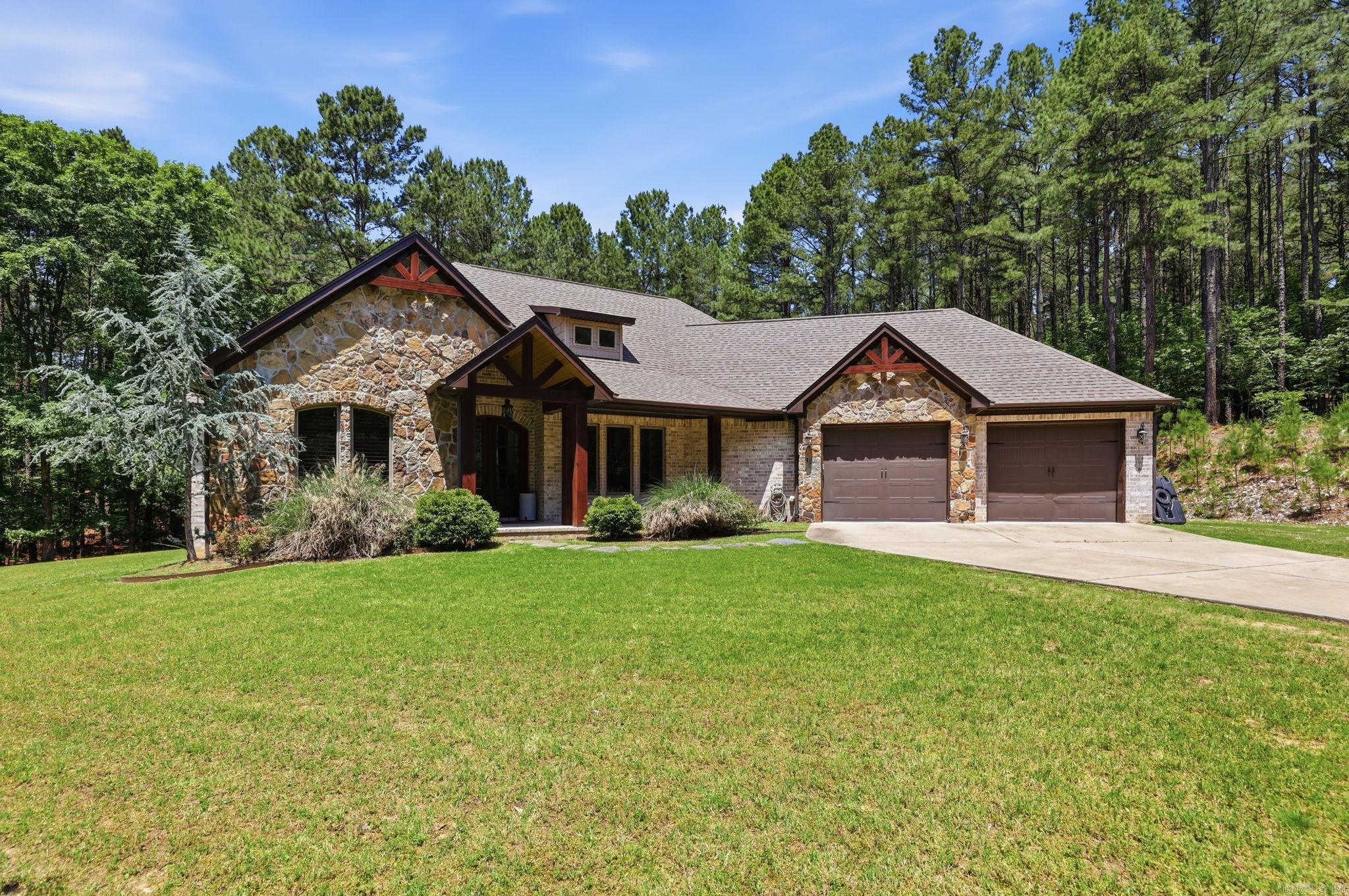 Welcome home! This beautiful craftsman farmhouse has so much to offer! There is great attention to detail in this home with granite countertops throughout, extra-large screened in porch with separate fireplace, gorgeous primary suite, in-house safe room, and an amazing open kitchen. You can't forget the MIL quarters which has a coffee bar, fridge, and separate access. There is also a beautiful office space with a great view. All of this on a secluded 5 acres! You don't want to miss this one. See agent remarks for more information.