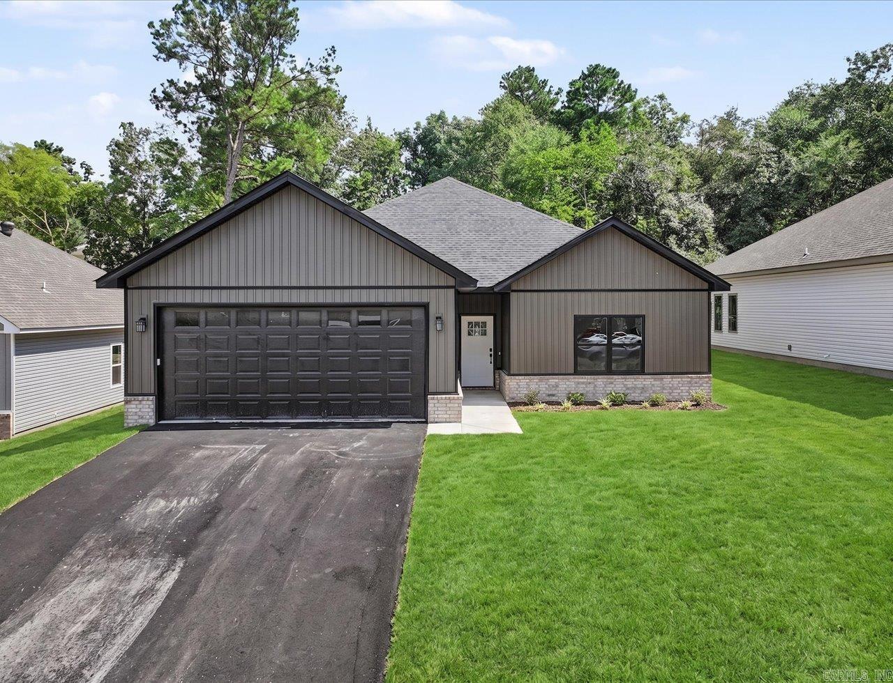 Discover this brand-new home in one of the most desirable areas off Marion Anderson Rd-located in the coveted Lake Hamilton School District and out of the city limits! Step inside to an inviting open floor plan, soaring vaulted ceiling, and a show-stopping designer LED electric fireplace that elevates the living space. Luxury touches are found throughout, including a modern neutral color scheme, white quartz surfaces, 9 ft ceilings, His/Her walk-in closets, and solid core interior doors for that high-end feel. Thoughtful upgrades set this one apart-automatic closet lighting adds convenience, while auto defrost bathroom mirrors provide a spa like experience everyday. The kitchen is fully equipped with all appliances, making this home move in ready from day one. Starlink internet. Agent/Owner.