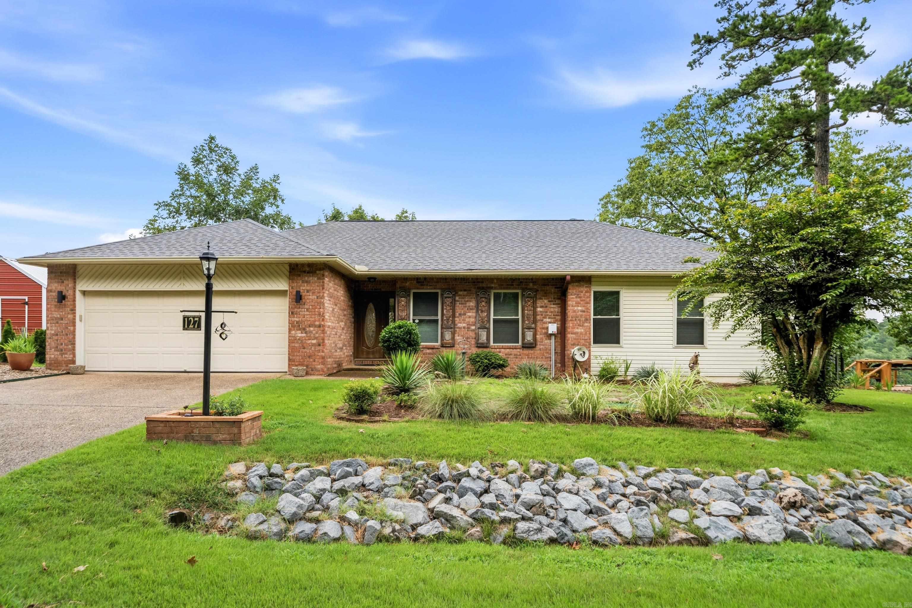 Discover the perfect blend of comfort, space, and lakefront living in this beautiful home on Lake Catherine, located in the desirable Diamondhead community. Offering 4 bedrooms and 3 full baths, this property is designed to make the most of its stunning waterfront setting. The main level features three bedrooms and two baths, along with a spacious kitchen, dining area, living room, and laundry room. Expansive windows and a large deck showcase breathtaking views of the lake, providing the ideal setting for relaxing, entertaining, or enjoying spectacular sunrises and sunsets. The lower level offers a generous family room, a full bath, and two versatile bonus rooms that are perfect for a home office, craft room, hobby space, or additional guest accommodations. A screened lower deck creates another inviting outdoor living area where you can unwind while taking in the peaceful waterfront scenery. Outside, enjoy direct access to Lake Catherine with your own boardwalk and swim dock, making it easy to spend your days swimming, fishing, kayaking, or simply soaking up the beauty of the lake. The gently sloping waterfront setting offers an exceptional outdoor lifestyle. Full house generator.