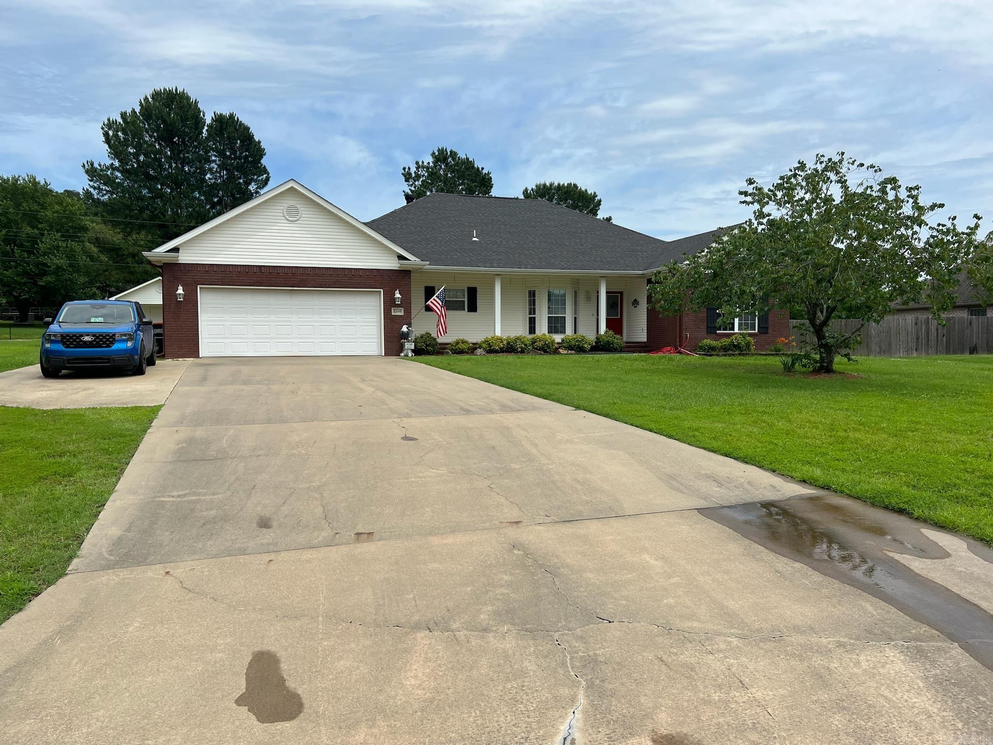 Welcome to this beautifully maintained 3-bedroom, 2-bath home located in a quiet cul-de-sac in Greenwood! Featuring a desirable split floor plan, this home offers both comfort and privacy. Enjoy the beautiful landscaping with colorful flowering shrubs that provide outstanding curb appeal. The spacious living areas create a warm and inviting atmosphere, while the covered back patio is perfect for relaxing or entertaining guests. Need extra space? This property sits on .56 acres a 24x24 shop and a 16x10 storage building, providing plenty of room for hobbies, tools, equipment, or additional storage. Conveniently located near schools, shopping, and dining, this home has been lovingly cared for and is move-in ready. Don't miss your opportunity to own this Greenwood gem. Schedule your private showing today!