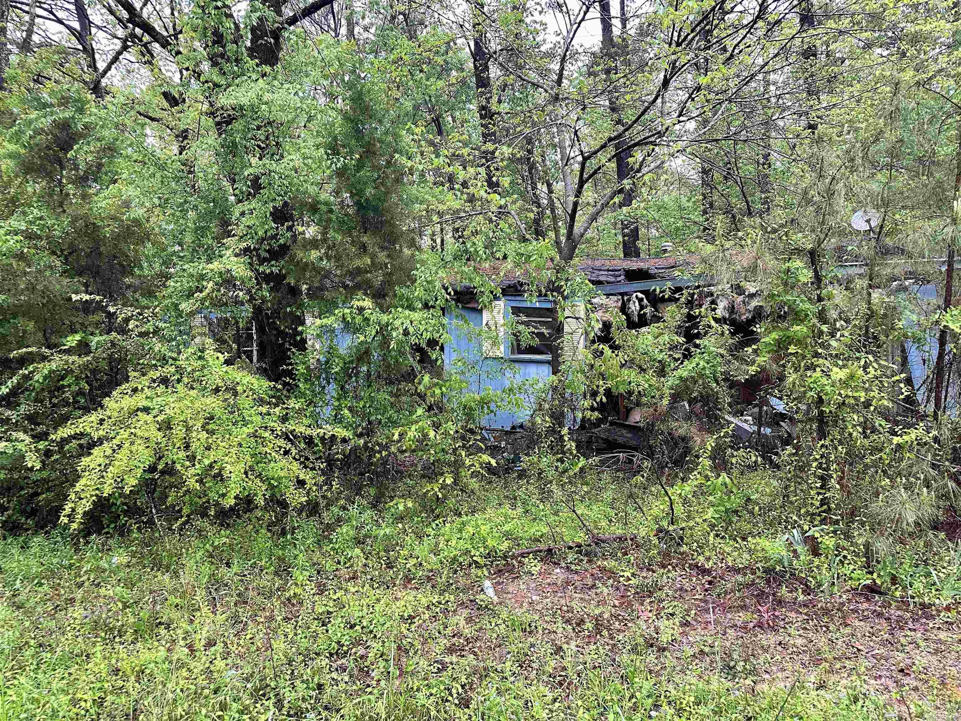 Investment opportunity. Home needs to be torn down, almost 1/2 an acre of land.