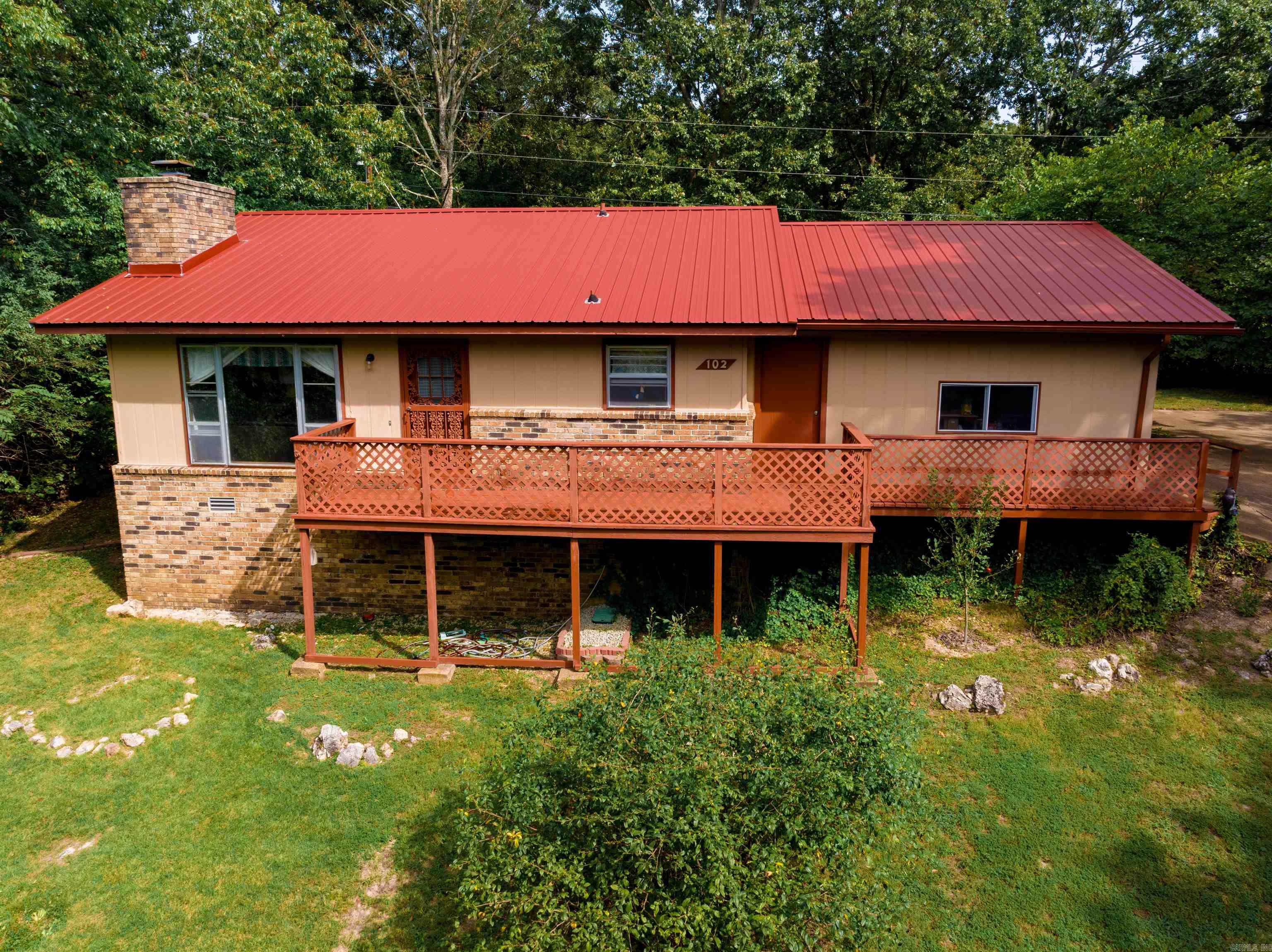 Nice home sitting surrounded by woods in a great location in Horseshoe Bend.  This home is move in ready, has a nice open concept, nice fireplace, large laundry room, work space, heat pump, like new carpet, and a large deck.  This home has a metal roof.  In this area you have so much to offer from a nice grocery store, dollar general, several places to eat and several lakes to enjoy!  Come look at this and enjoy our town!