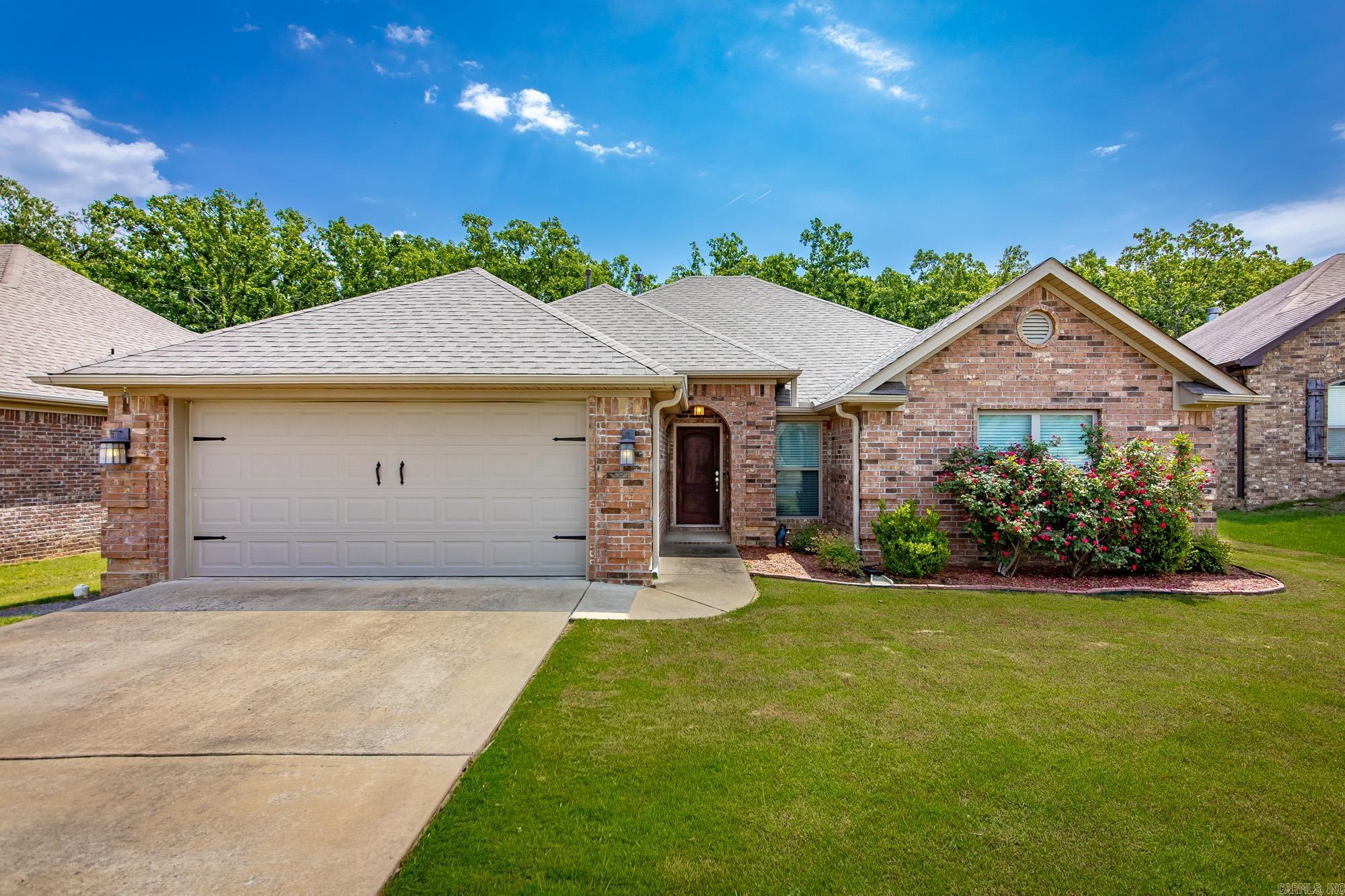 Amazing entry point into a neighborhood with many larger homes!  Great find for Millers Glen in Sherwood.  This all brick split bedroom 4 bed/2 bath home, on a flat lot on a low traffic street backs up to green space.  Step inside to a home with lots of attention to detail from its soaring ceilings, elevated trim, arched doorways - there is much to love!  Check out the covered patio out back and the extra large laundry room.  Granite counters in wet areas and hardwoods and carpet throughout.  New roof:  2022.  Agents see remarks