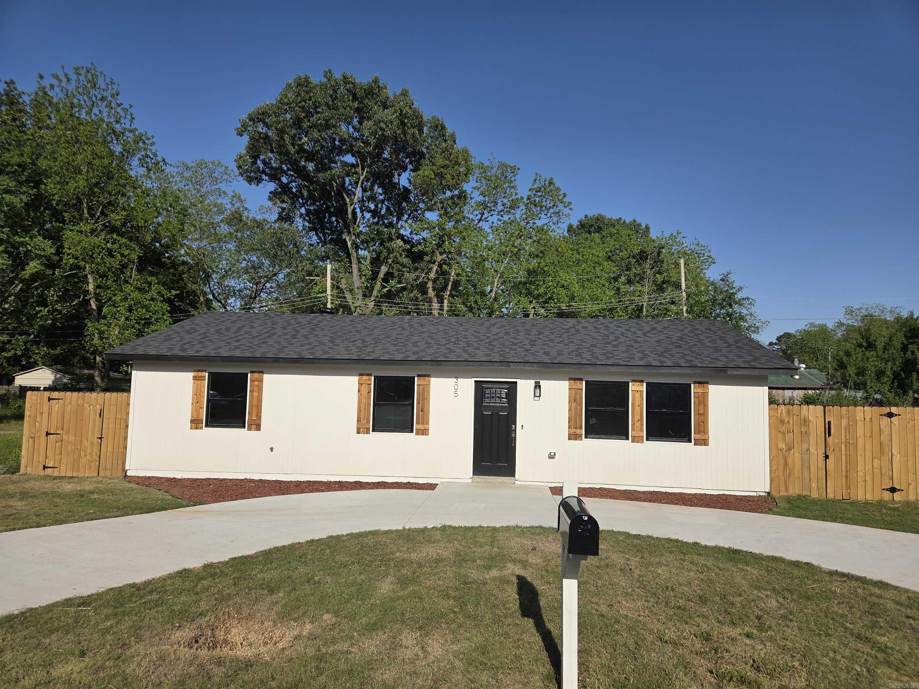 Extensively rebuilt, this home retains only the original slab foundation and approximately 25% of the framing. Nearly everything else has been replaced, including the roof, plumbing, electrical system, and central HVAC. The home offers 3 bedrooms and 2 bathrooms with the convenience of modern construction and updated systems throughout.  Inside, you'll find a freshly painted interior with recessed lighting and luxury plank flooring. The redesigned kitchen features updated countertops, new cabinetry with a pantry, stainless steel appliances, and a separate dining area. Both bathrooms have been updated with custom tile showers, while the primary en-suite includes upgraded tile flooring. The master bedroom offers an oversized walk-in closet, and the guest bedrooms feature oversized closets for additional storage.  Located on a corner lot, the exterior includes new sod, a newly poured concrete circle driveway, a covered front porch, and a large fenced backyard with a new patio. With extensive updates throughout, this move-in-ready home combines modern finishes with the benefits of a near-complete rebuild. This home is eligible for USDA Loans