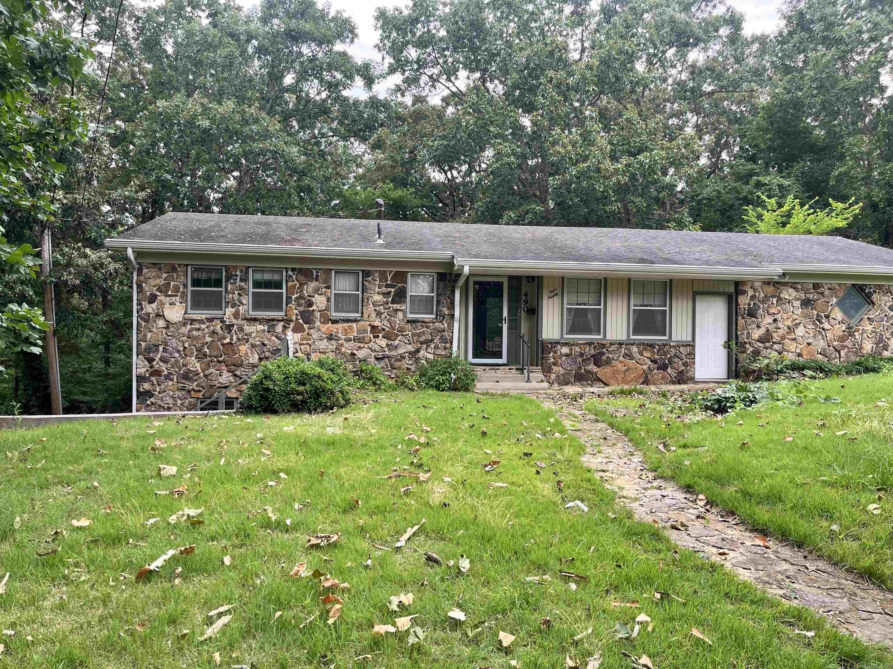 Tucked away at the end of a quiet dead-end street, this spacious 4 bedroom home offers room to spread out inside and out! With minimal traffic and a large backyard, the setting provides both privacy and convenience.  The main level features approximately 1,230 SQFT with 2 bedrooms, 1.5 bathrooms, laundry area, kitchen, and a comfortable living room. Downstairs, the walkout basement adds an additional 1,120 SQFT complete with a second living area, 2 bedrooms, kitchenette, and a full bathroom -- offering great potential for multi-generational living, guests, or extra entertaining space.  Built in 1965, this home features an HVAC system less than 5 years old. Sold AS IS and needing some TLC, it's priced to give buyers a great opportunity to add their own touch and build equity.