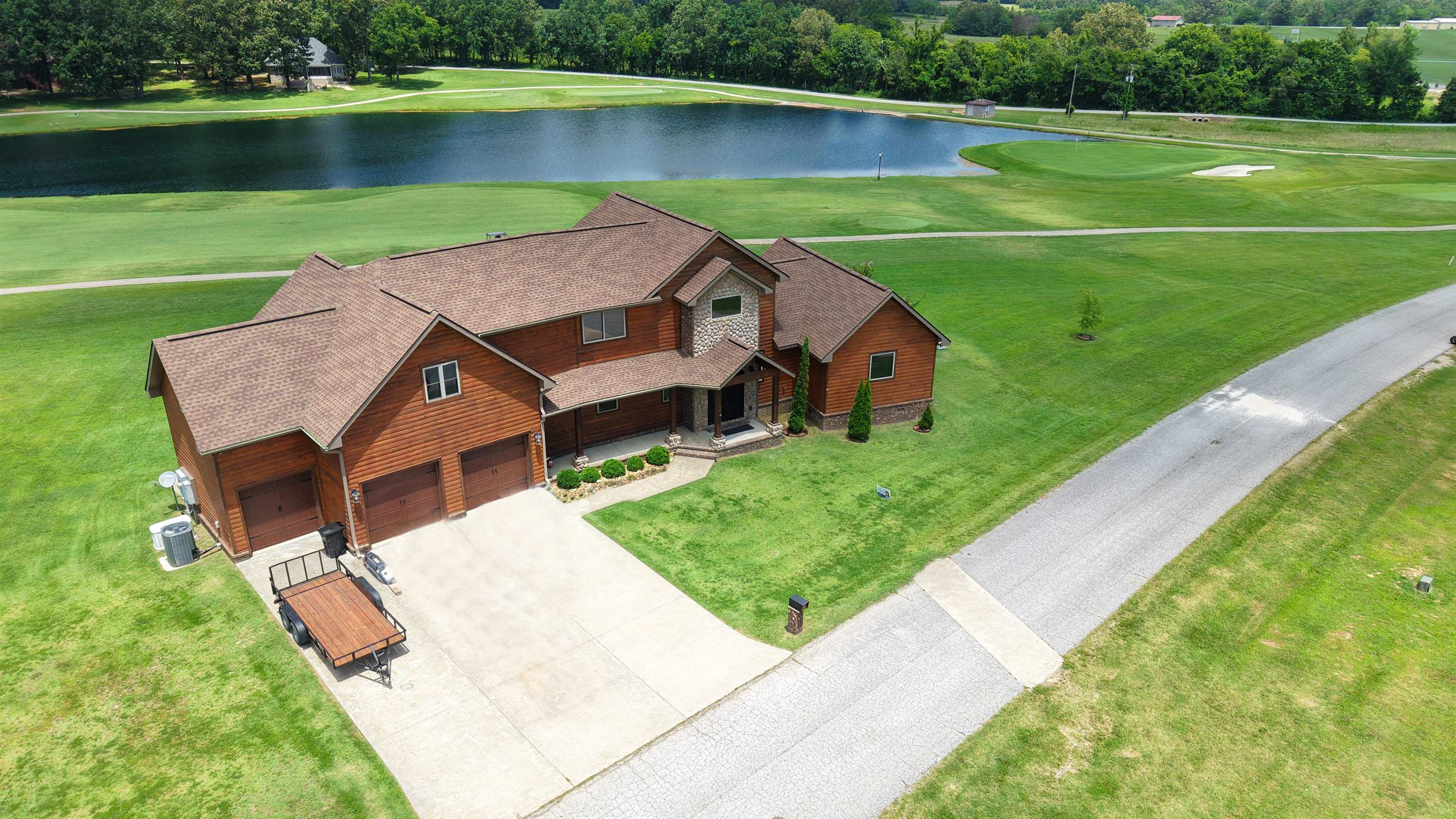 Experience luxury golf course living in the prestigious Cooper’s Hawk subdivision in Melbourne, Arkansas. Built in 2019, this custom 3-bedroom, 3-bath home offers championship golf course frontage and scenic pond views. Designed with craftsmanship and modern finishes, the open-concept layout features high ceilings, luxury flooring, and expansive windows that capture natural light and scenic views. The spacious living area centers around a cozy gas-log fireplace, while the gourmet kitchen impresses with granite countertops, custom cabinetry, premium appliances, and a large island. The main-level primary suite offers a spa-style bath, dual vanities, and a generous walk-in closet. A guest bathroom is conveniently located on the main floor for added accessibility. Upstairs includes two additional bedrooms, a full bath, and a flexible loft ideal for an office or media space.  Conveniently located near Melbourne’s amenities, this move-in ready home delivers the perfect blend of luxury and location—priced at $419,900 in one of North Central Arkansas’s most desirable golf communities.