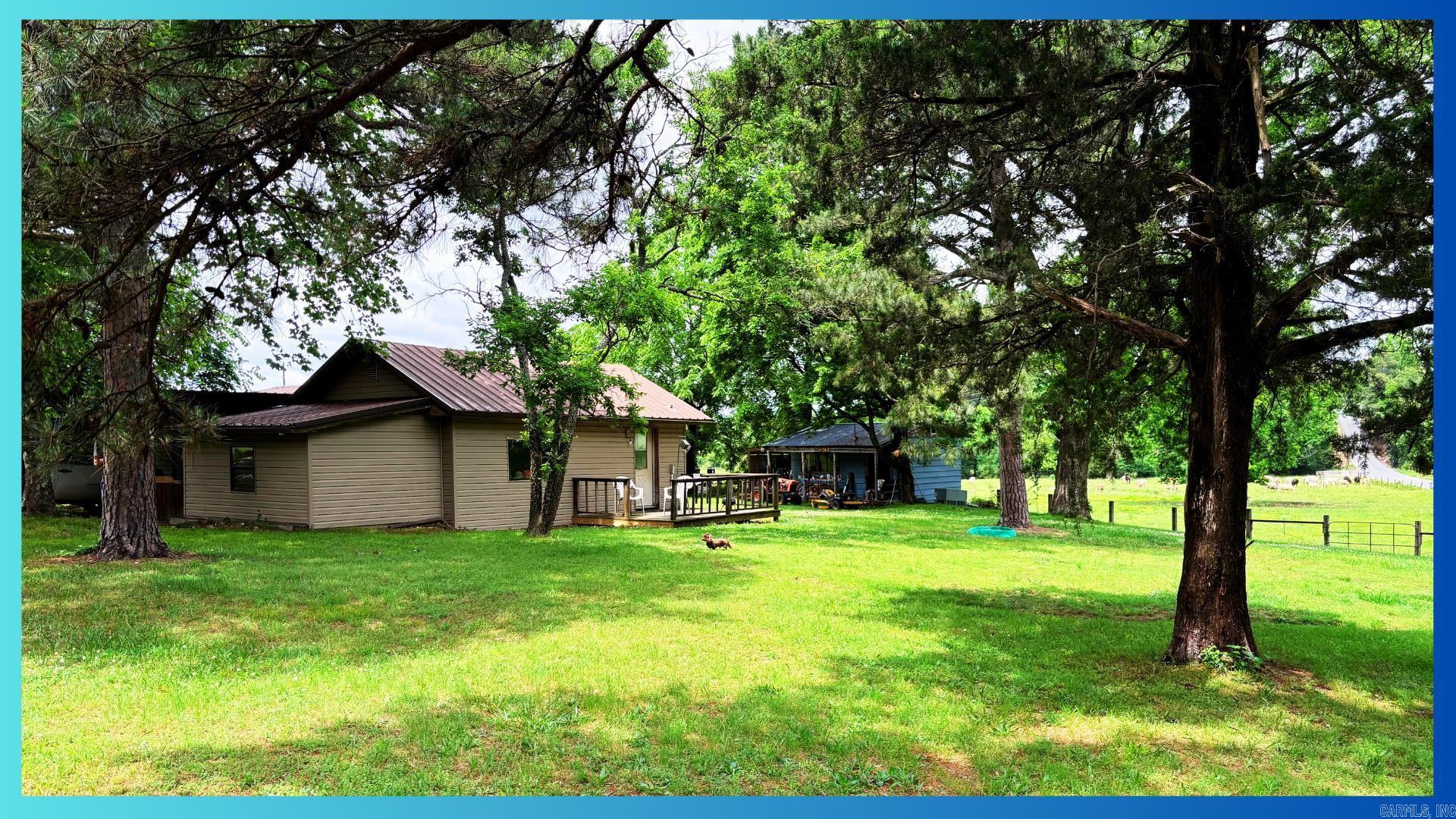 After you finish your breathtaking scenic drive through rolling hills you will arrive at the perfect spot! This home has a wonderfully functional floorplan!  Walk into an open kitchen/living space and continue on to your massive primary bedroom with humongous closet!  Here we also have a great little guest bedroom and 1.5 Baths. Exterior siding has been recently replaced (3 yrs ago).  This property also features a 12X20 Heated SHOP along with a 10X14 Lean-to. We're right on Polk 42 with great access to Ouachita National Forest ATV trails with this one!