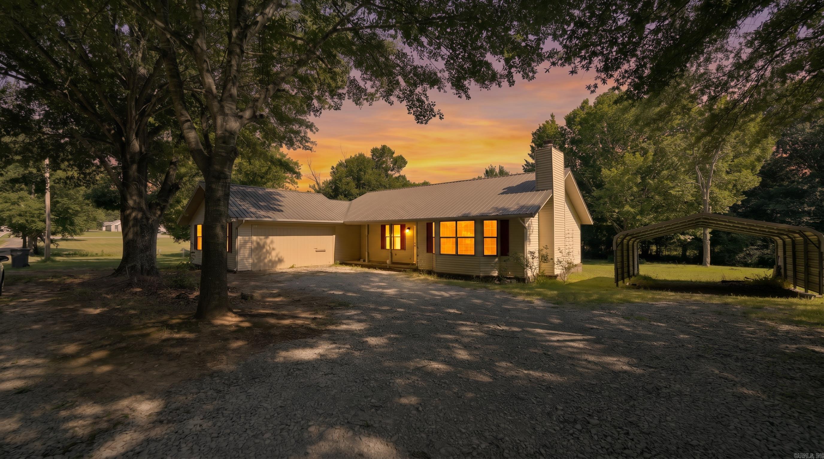 Country Home in the Ozarks Enjoy peaceful country living on approximately one level acre just minutes from Batesville. Surrounded by mature shade trees, this well-maintained home offers the perfect balance of privacy and convenience with shopping, dining, schools, and everyday amenities nearby.   Inside, you'll find approximately 1,629 square feet featuring two spacious bedrooms, one full bath, one half bath, and an oversized bonus room that could serve as a family room, home office, hobby space, guest room, or potential third bedroom.   The home features durable metal siding, a metal roof, and aluminum double-pane windows for low-maintenance living and improved energy efficiency. Relax on the inviting front porch or unwind on the back porch while enjoying the peaceful setting. A two-car carport and storage shed provide plenty of space for vehicles, tools, and equipment.   Whether you're searching for a full-time residence, weekend retreat, or affordable country home near town, this Ozarks property is ready to welcome you home. Owner/Agent!