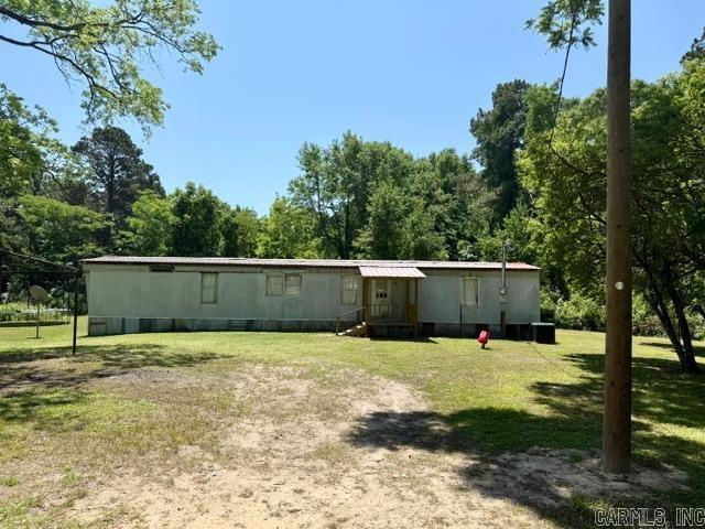 12.6 acres with several Plum, Pear and Black Walnut trees. Bike trail through the land. Metal roof 2022.