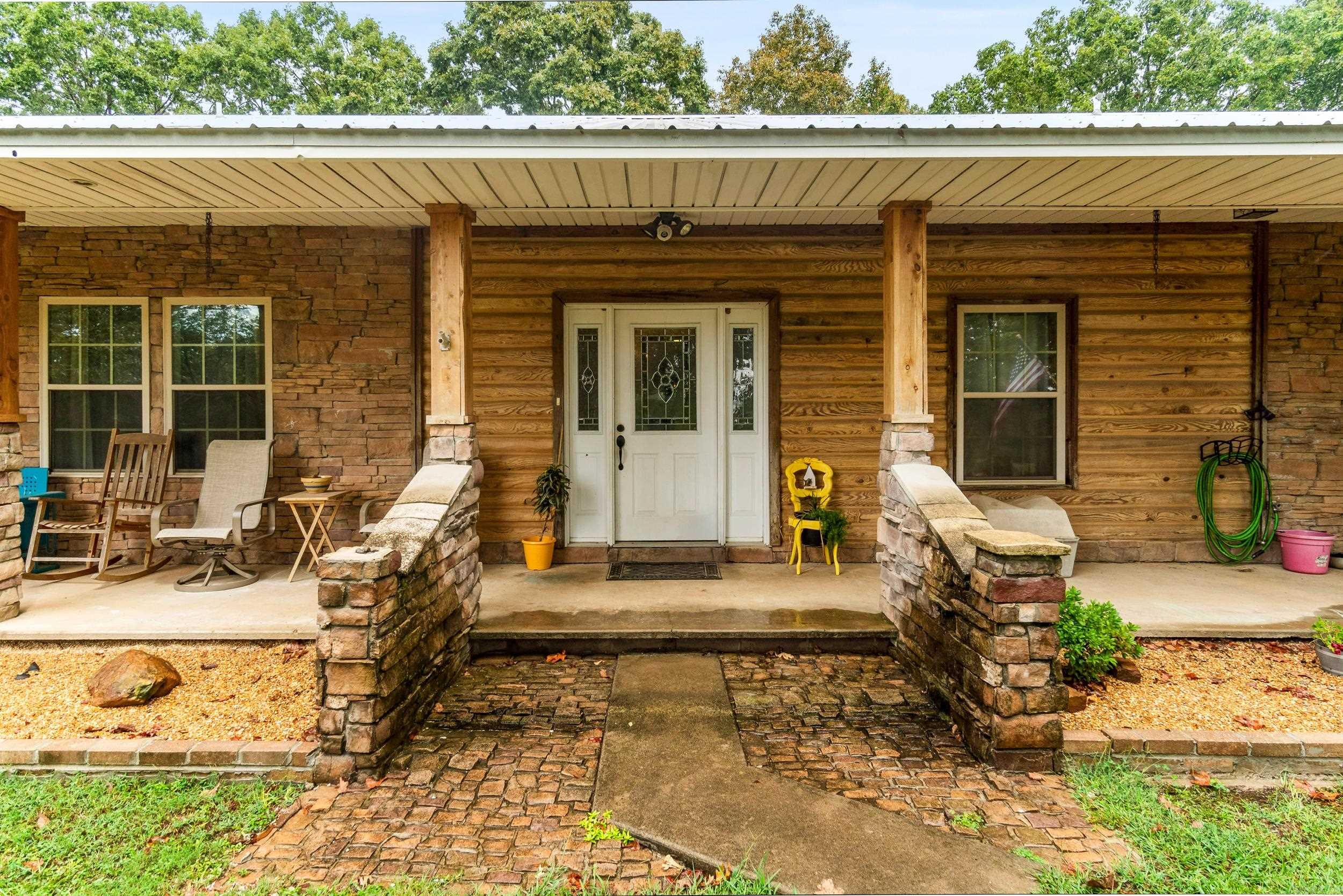 This Magnificent Home with a View that is Amazing. The concrete driveway leads you to this immaculate beautiful home. The Home has features a Sunroom with Lots of Natural Light, The Home has lots of Space for a Big Family or lots of Guest. Master Bath was just remodeled with a one of a kind walk in Shower and New Tub and Lots of space and double sink Vanity. The home features extra space for a home Office and Another room that can be for a craft / exercise room. Beautiful Foyer when you enter thru the front door and Large kitchen for entertaining or a large family. The shop is 30X40 with insulation and Electricity and with a 20X36 Lean to and Roll up doors and 16 Ft Sidewalls. Tile Floors in Kitchen and 3 bathrooms. Metal Roof and Tongue and Groove in Family Room also features hardwood Floors. Wood Stove for Cold Winter days in the Living Room. Close to Lake Barnett for Fishing Enthusiast in the family.  Call Me Today !! See Agent Remarks