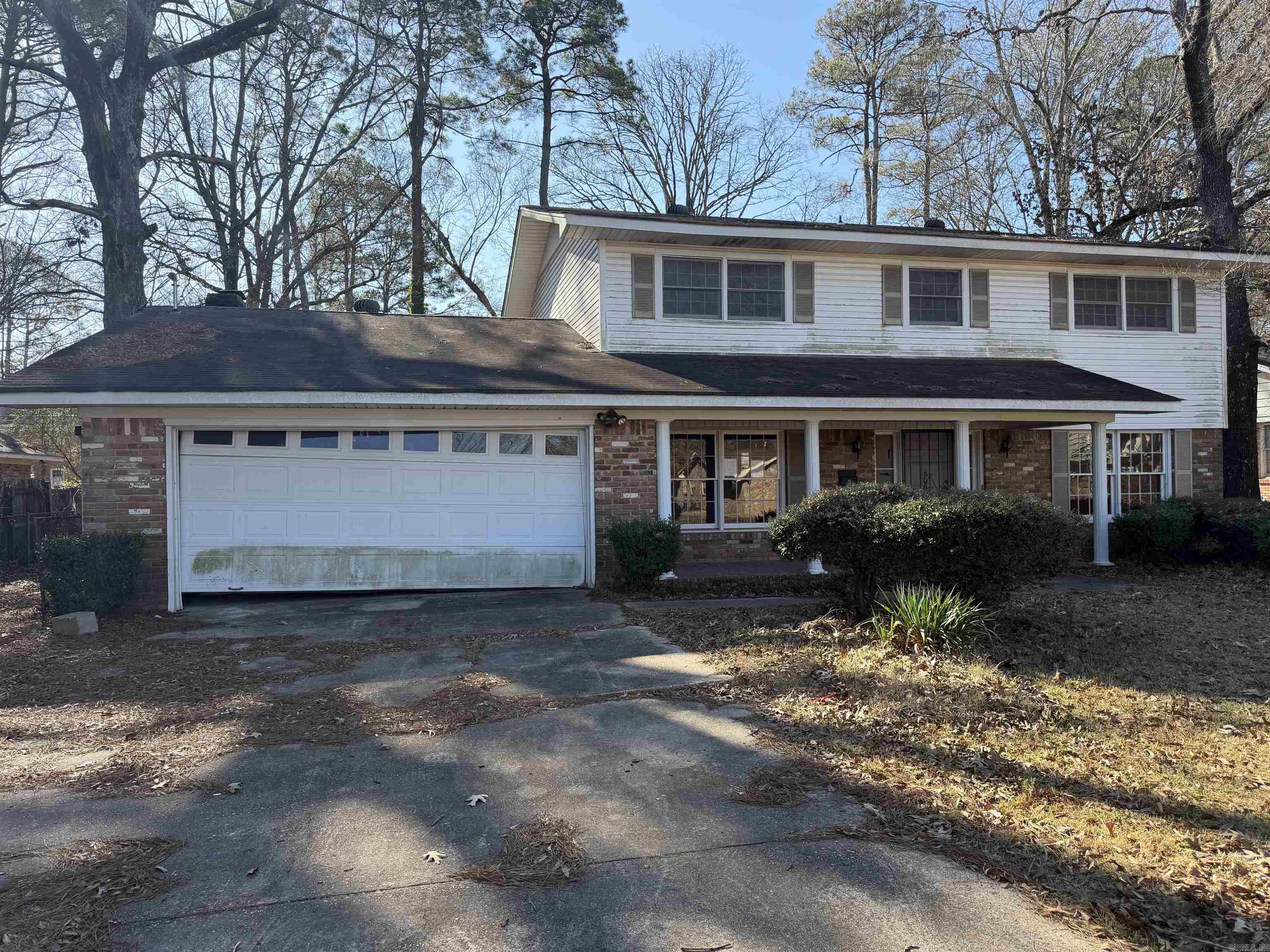 Spacious 3 bedroom, 3 bath home offering 2,483 square feet on a 0.29-acre lot in an established subdivision. Built in 1966, this property presents a true renovation opportunity for investors or buyers ready to add value. The home appears largely original with no significant updates since construction. Downstairs flooring has already been removed down to the concrete slab, providing a blank canvas for new finishes. Upstairs features original hardwood floors that will need to be stripped, sanded, and refinished. Kitchen and baths are in original condition and will require full updating, including new appliances. Classic layout with generous room sizes, brick fireplace, built-ins, and an attached garage. Exterior offers mature trees and a level lot. Ideal for a full remodel, flip, or long-term investment. Sold as-is; needs work/TLC. Great potential for the right buyer. Agents see remarks.
