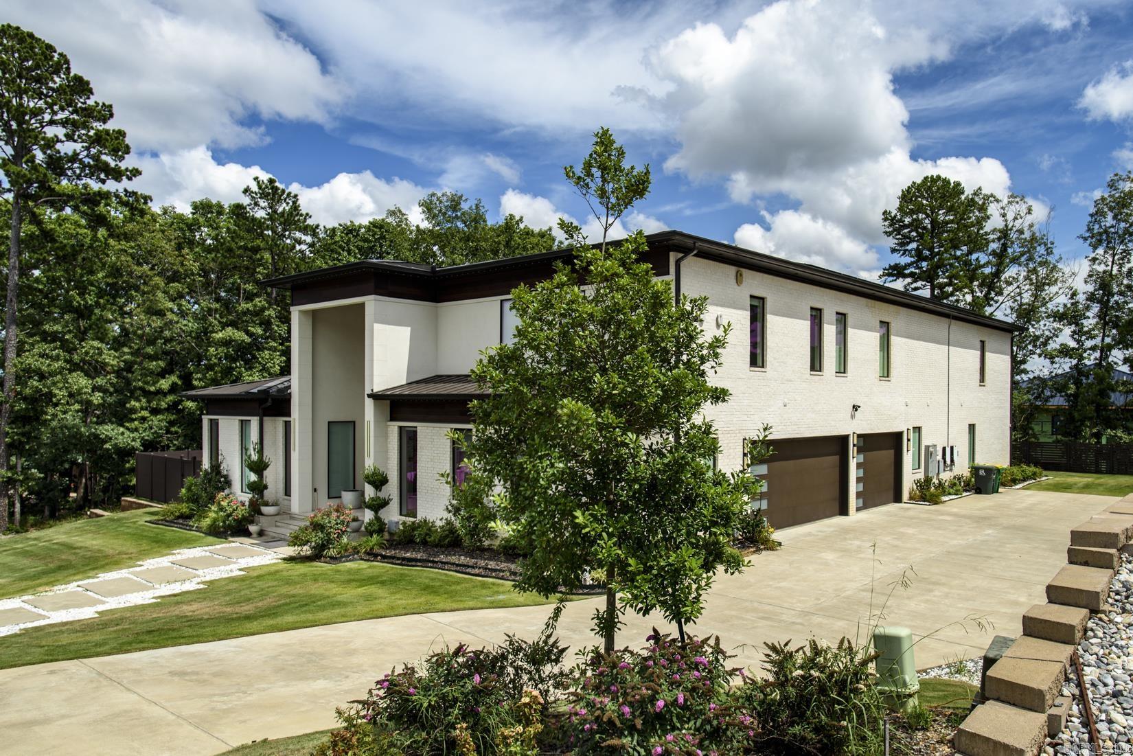 Luxurious, custom-built contemporary home built by Melinda Marcus. This light-filled home in the gated golf course neighborhood of Orle' boasts 5 bedrooms, 5 full and 3 half baths, 2 laundry rooms, elegant chef's kitchen with 2 islands, Dacor and Bosch appliances, a prep kitchen, office, exercise room, media room, all with the finest of finishes. All bedrooms have ensuite baths. The covered veranda has heaters for year round enjoyment and an outdoor kitchen. This area overlooks a swimming pool surrounded by turf, outdoor shower and half bath. 3 car garage, Tesla charger, solar panels, built-in holiday soffit lighting are just a few of the fine amenities of this beautiful home. Call today for a private showing!